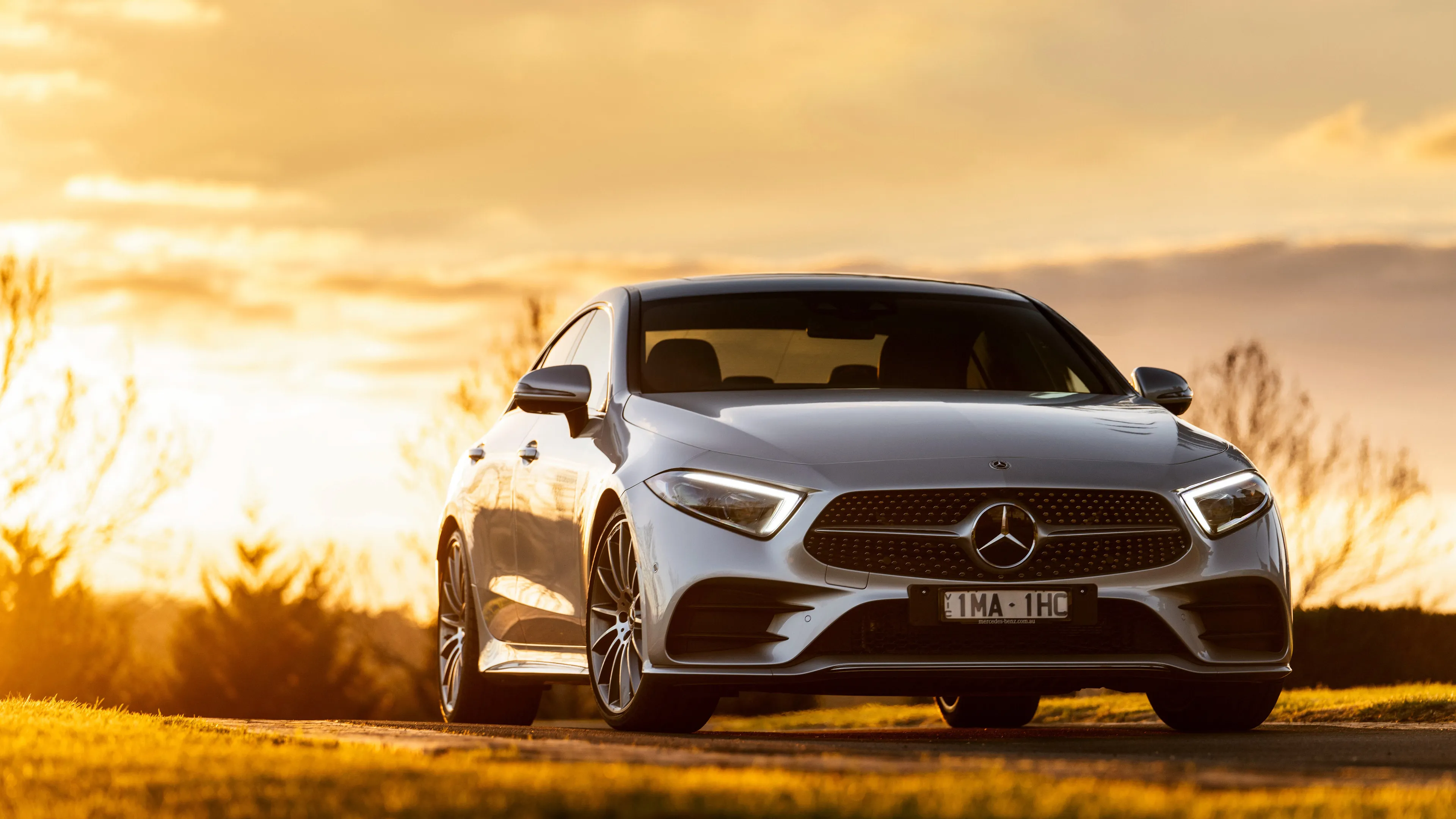Mercedes Benz SUV Driving on Road During Golden Hour image