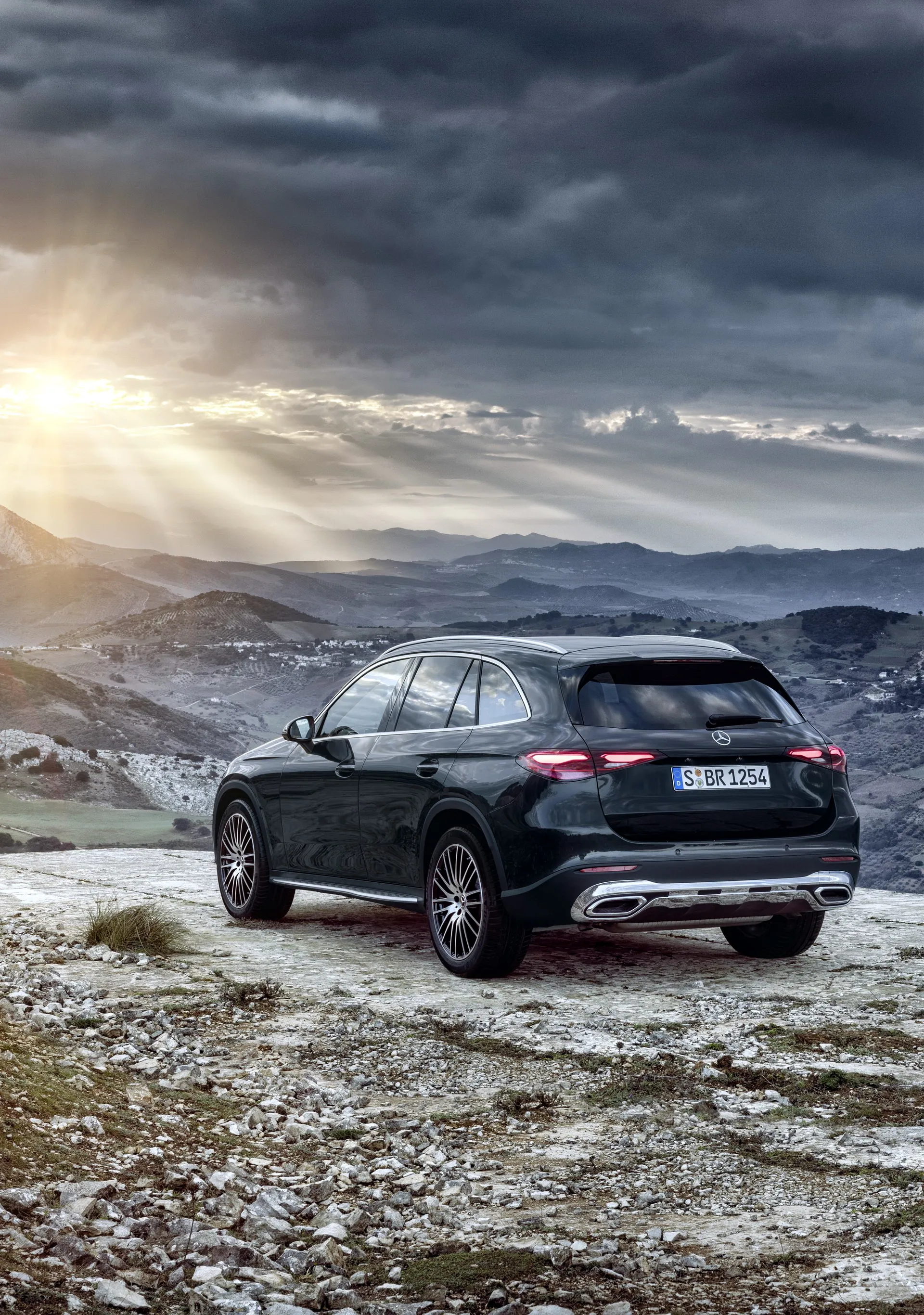 Mercedes Benz SUV Driving on Snowy Mountain Road Wallpaper