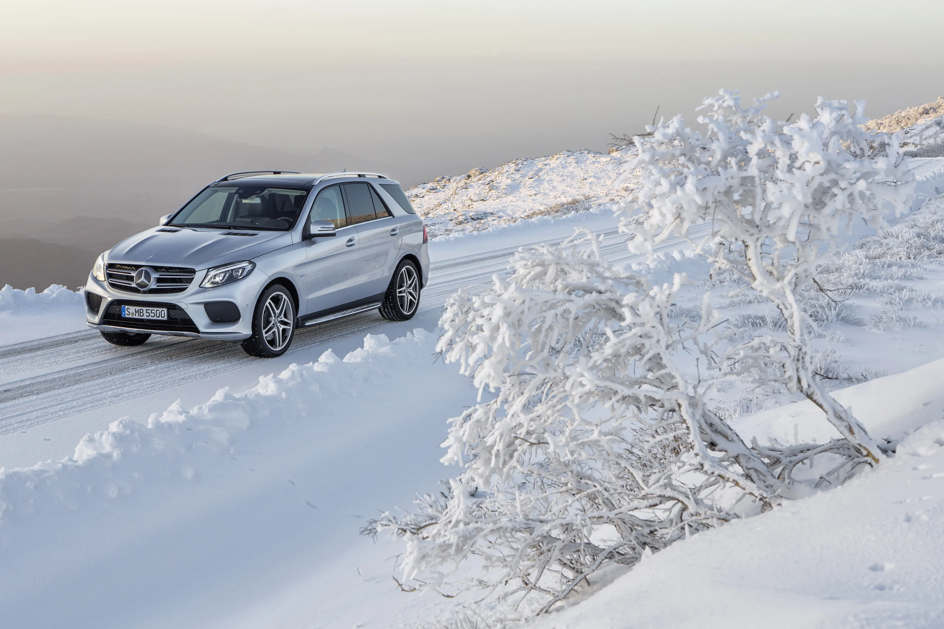 Mercedes Benz SUV in Icy Forest with Snow Covered Road