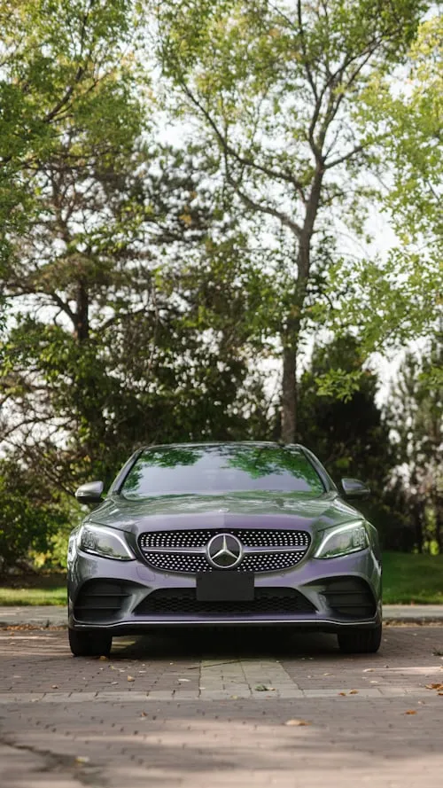 Mercedes Benz SUV Parked in Lush Green Driveway Wallpaper