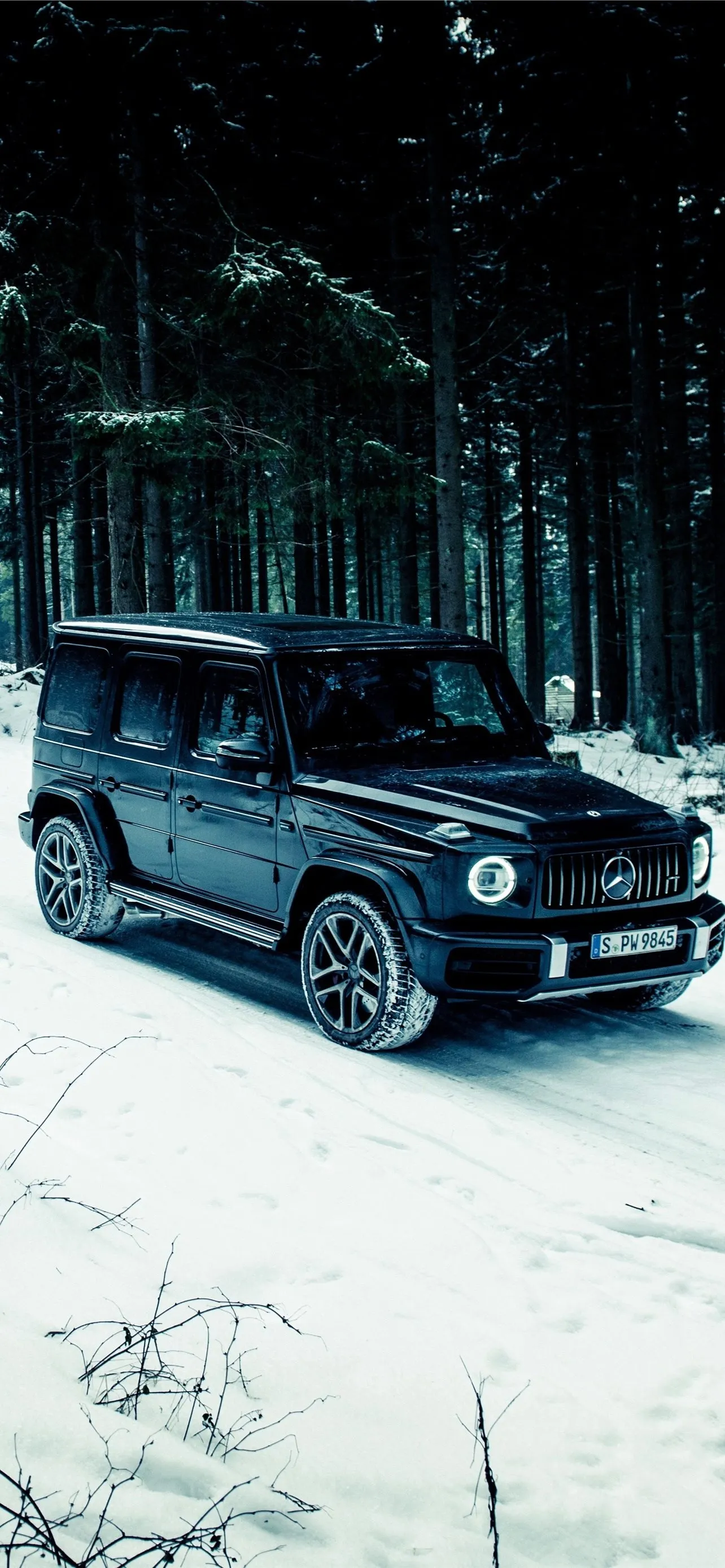 Mercedes Benz SUV Parked in Snowy Winter Forest image