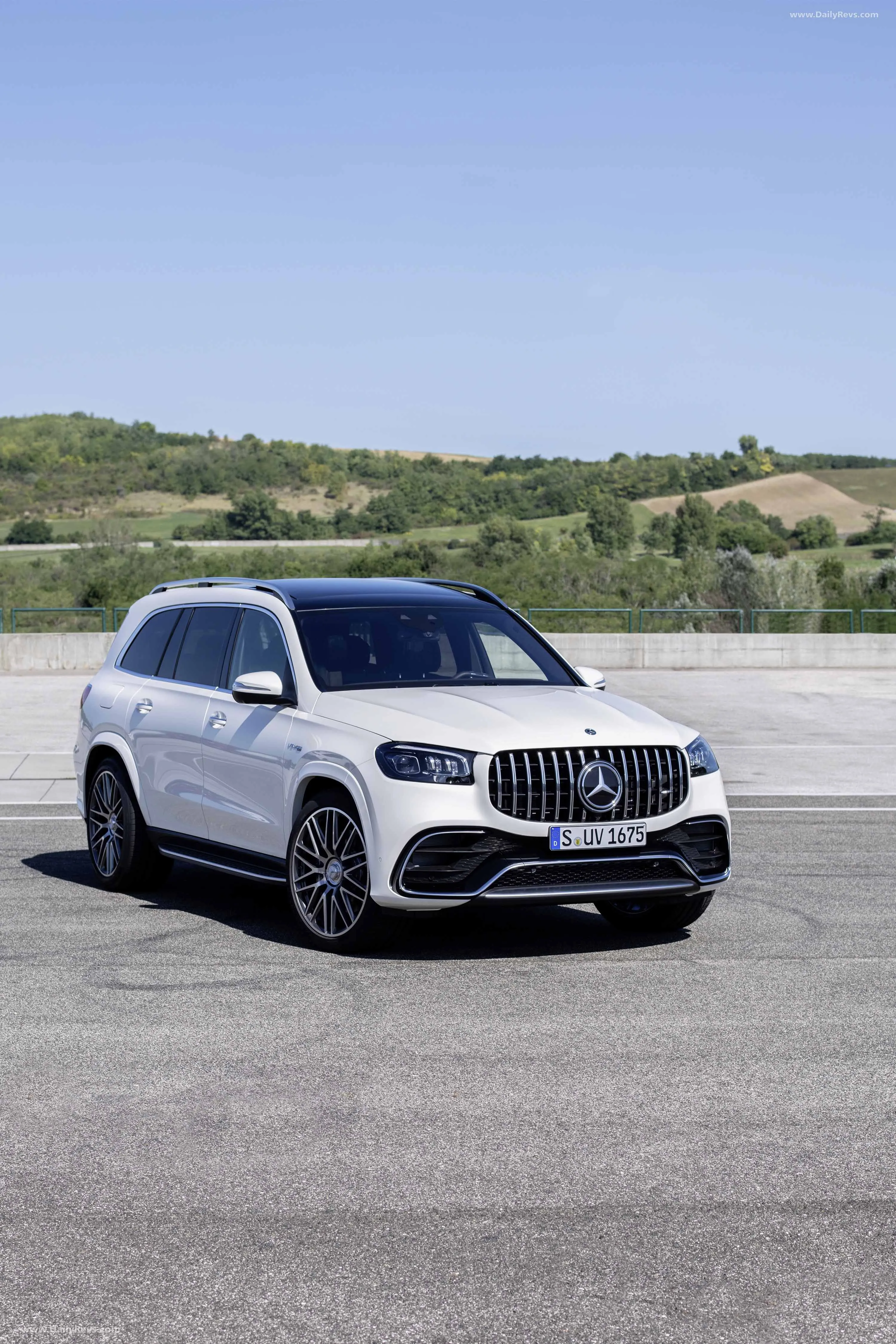 Mercedes Benz SUV Parked on Open Road with Hills in View