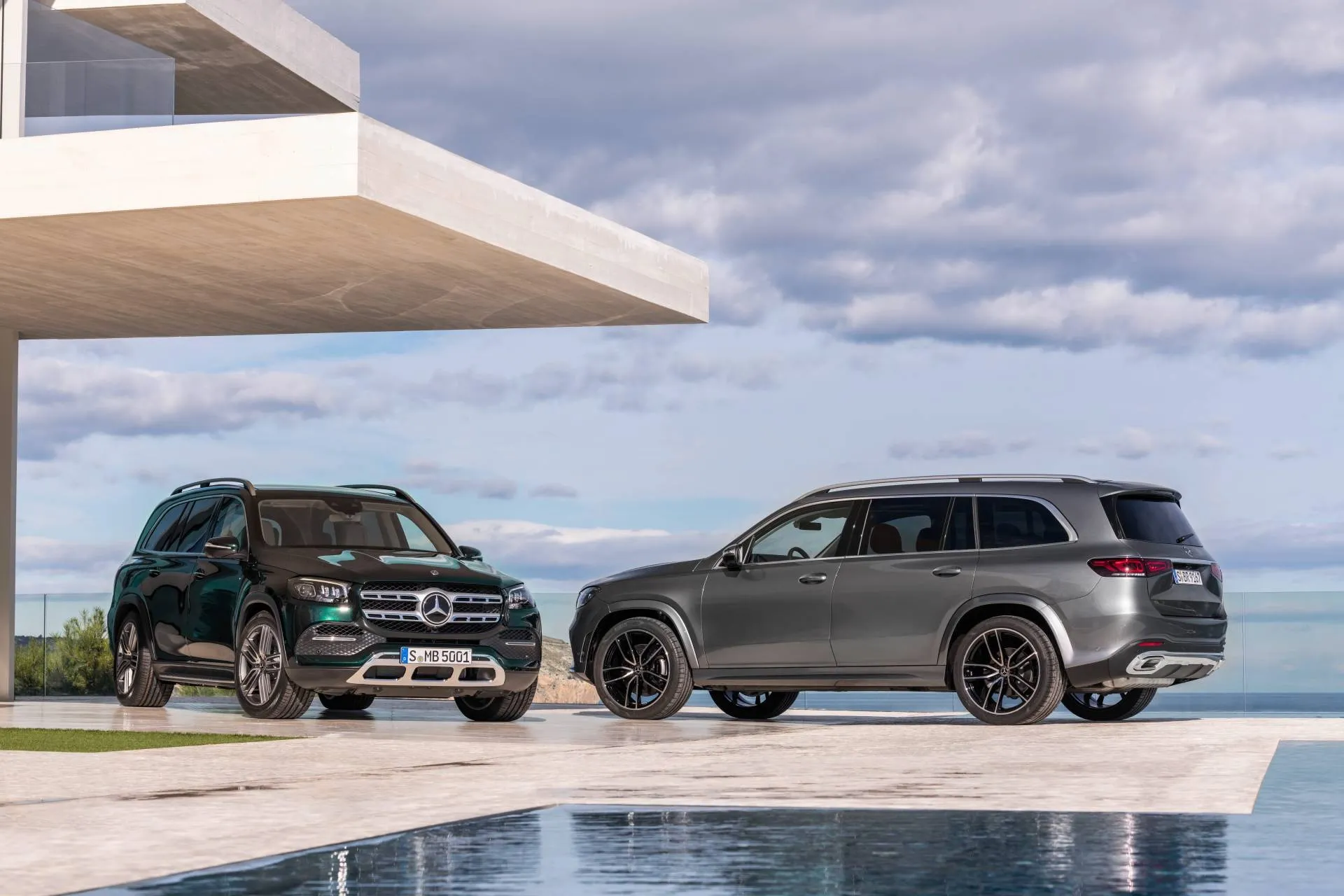 Mercedes Benz SUVs Parked Near Modern Architectural Structure