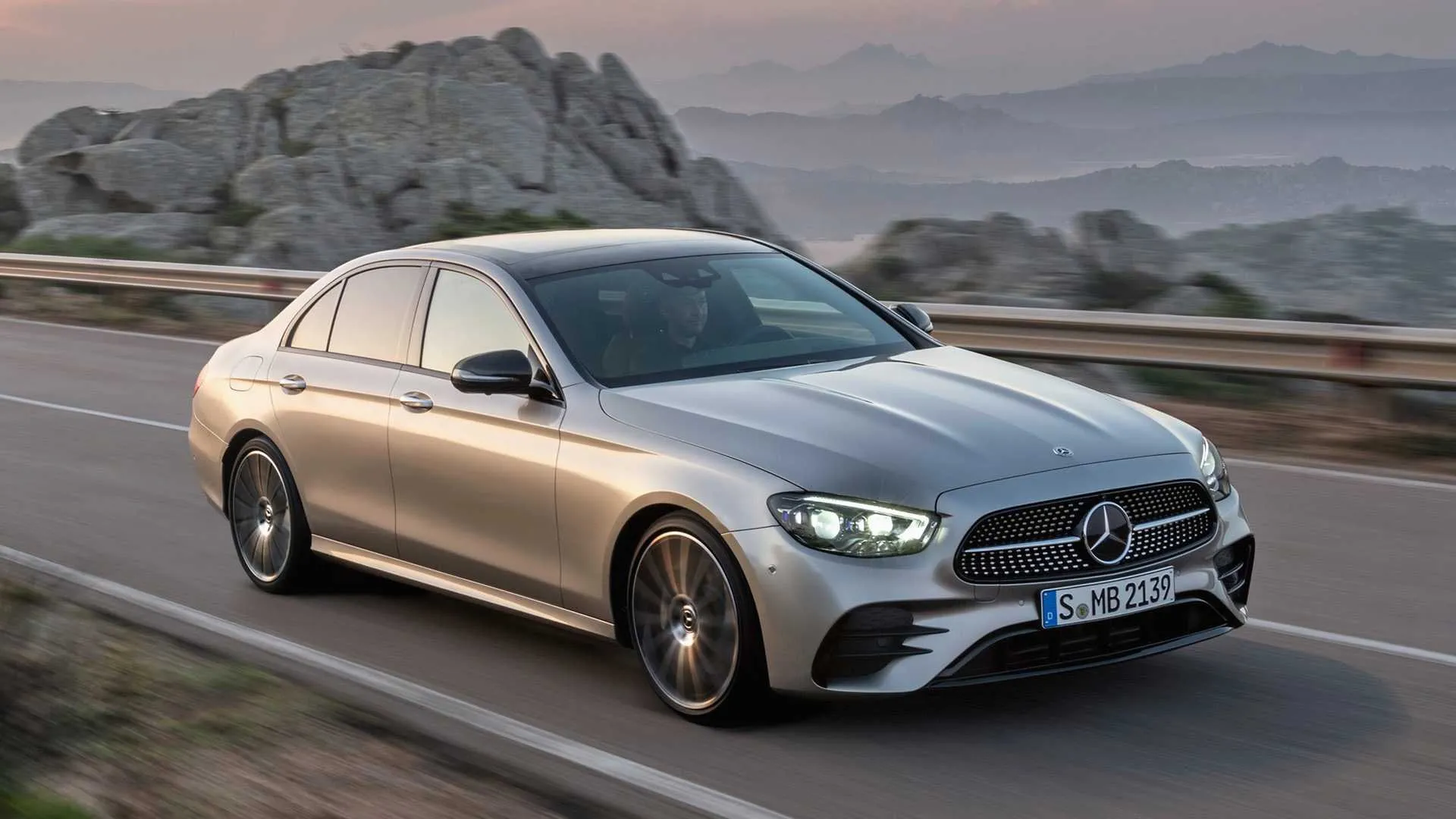 Mercedes Coupe Driving Fast Along Coastal Mountain Road