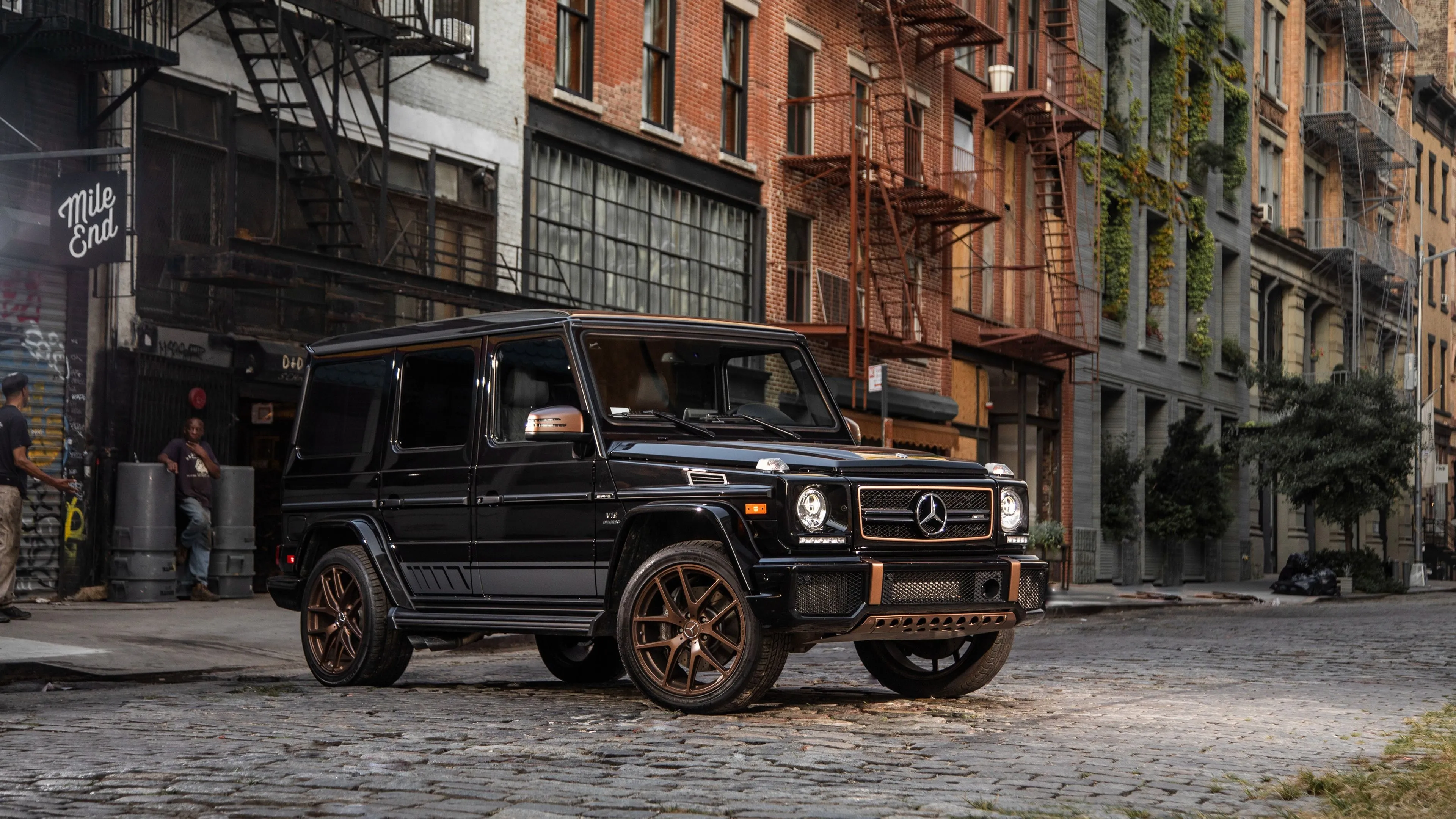 Mercedes G Class Parked Near Rustic City Street Buildings