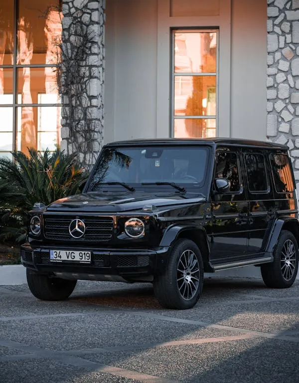 Mercedes G Wagon parked near modern luxury home image