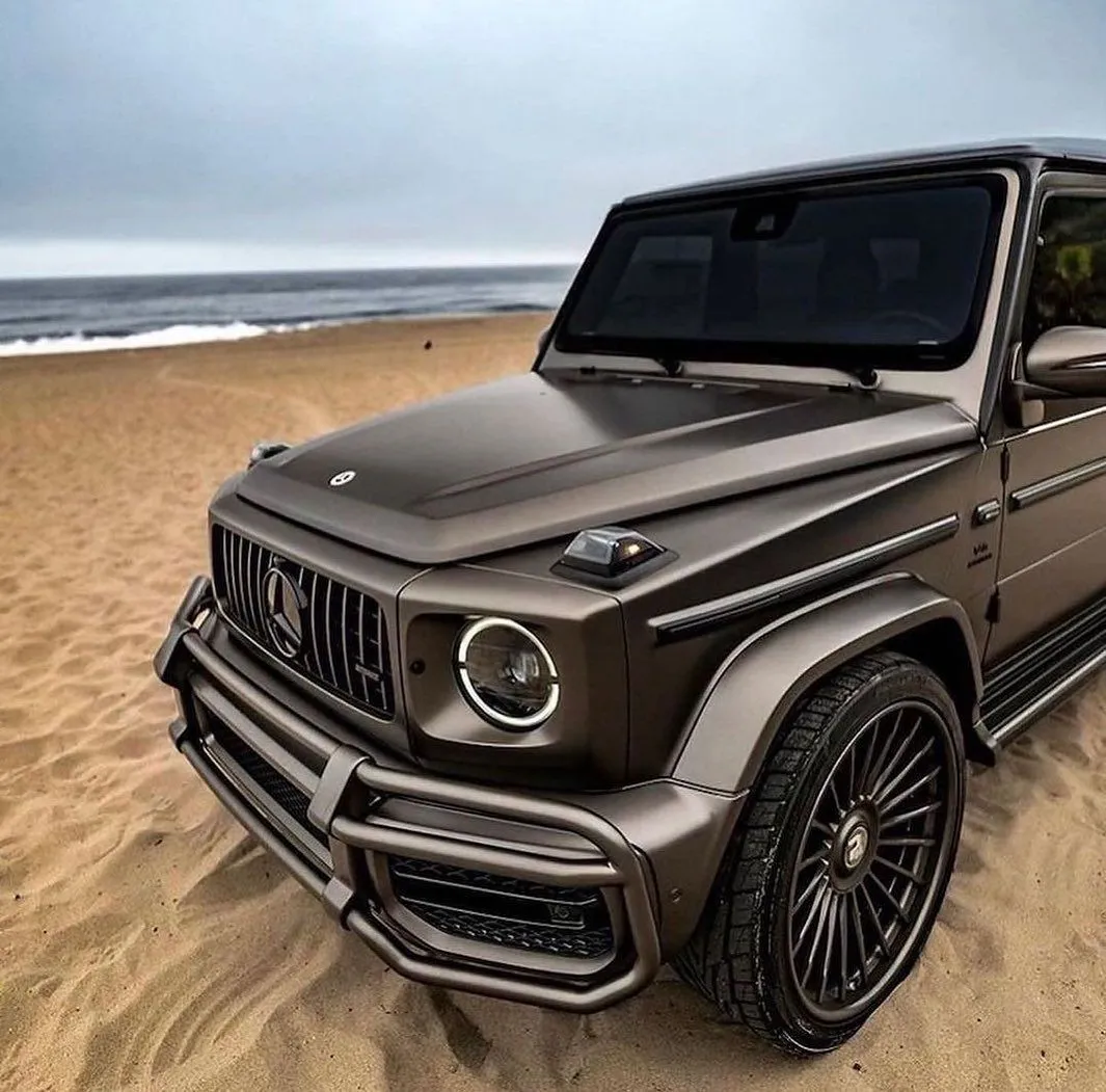 Mercedes GClass SUV Driving on Sandy Beach free Wallpaper