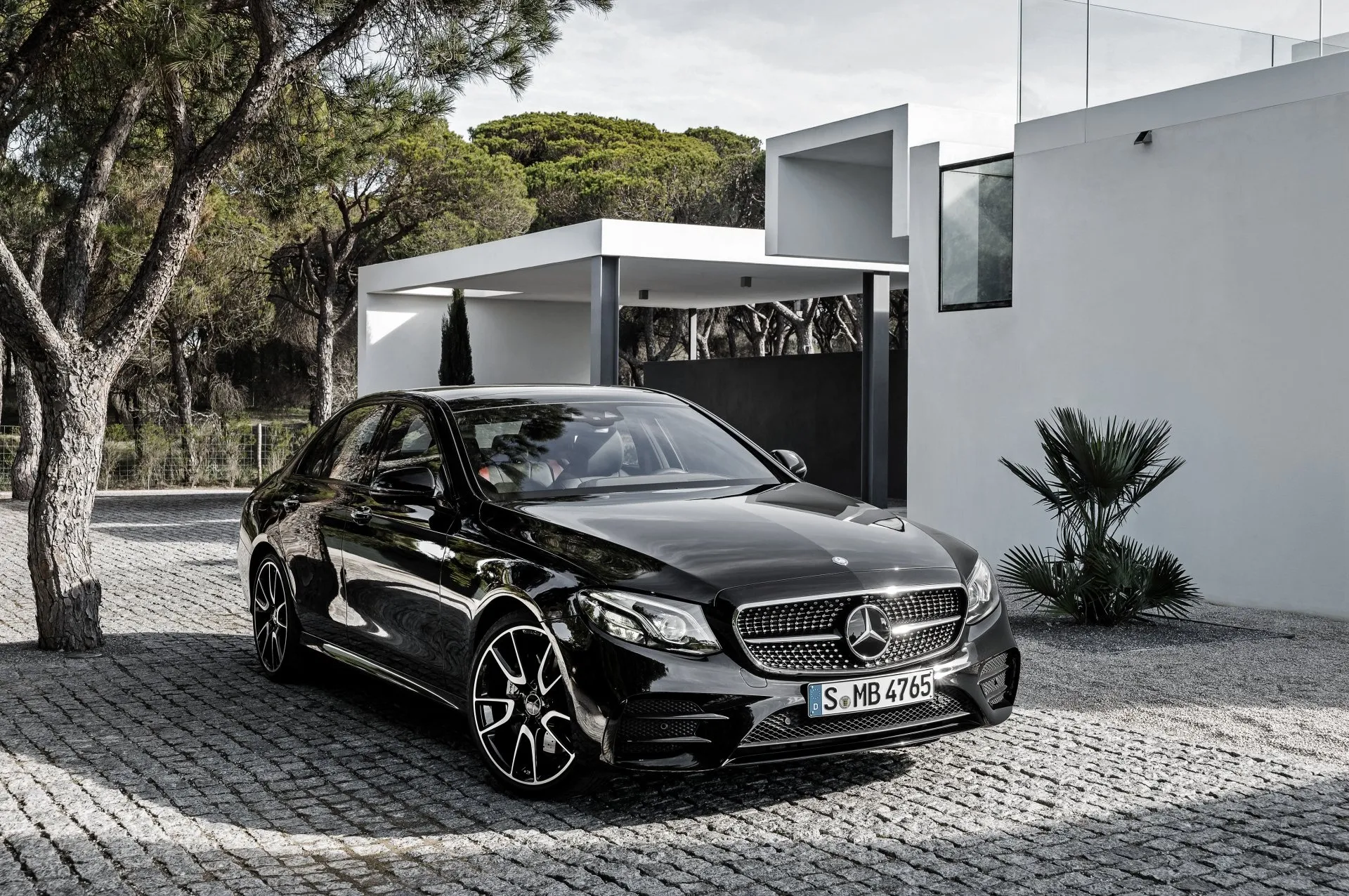 Mercedes Hatchback Parked by Minimalist House Wallpaper
