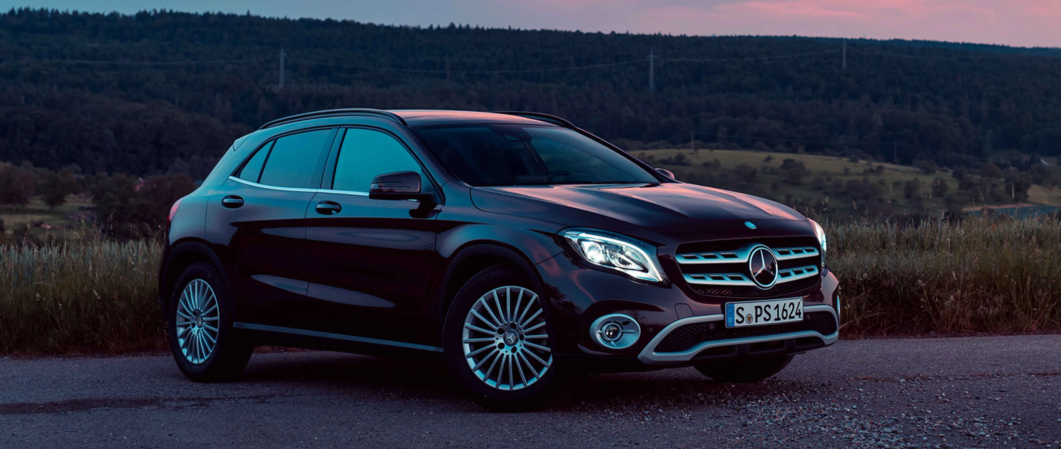 Mercedes Hatchback Parked on Rural Road at Sunset image