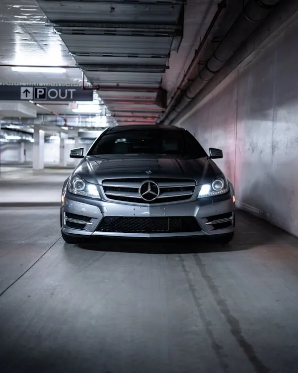 Mercedes in Urban Parking Garage with Dim Lighting