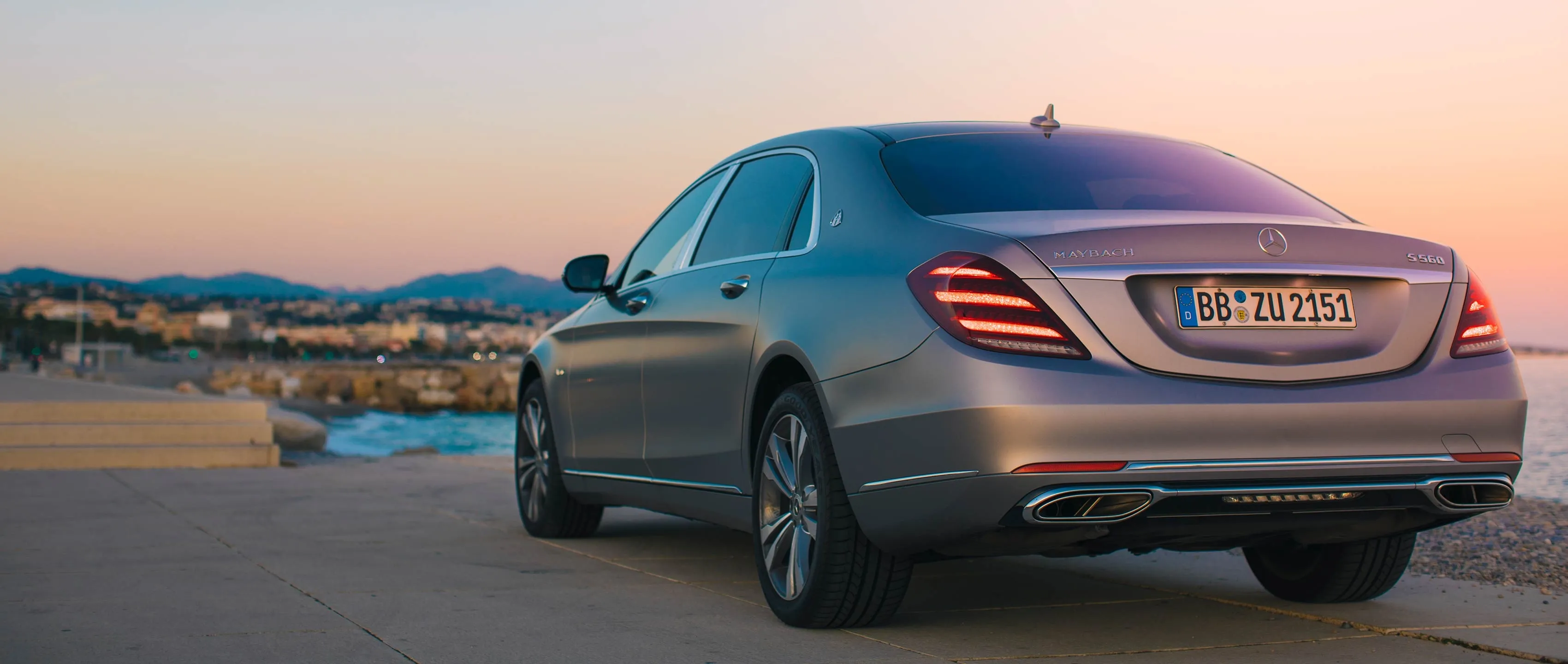 Mercedes Luxury Sedan Driving At Sunset Wallpaper HD