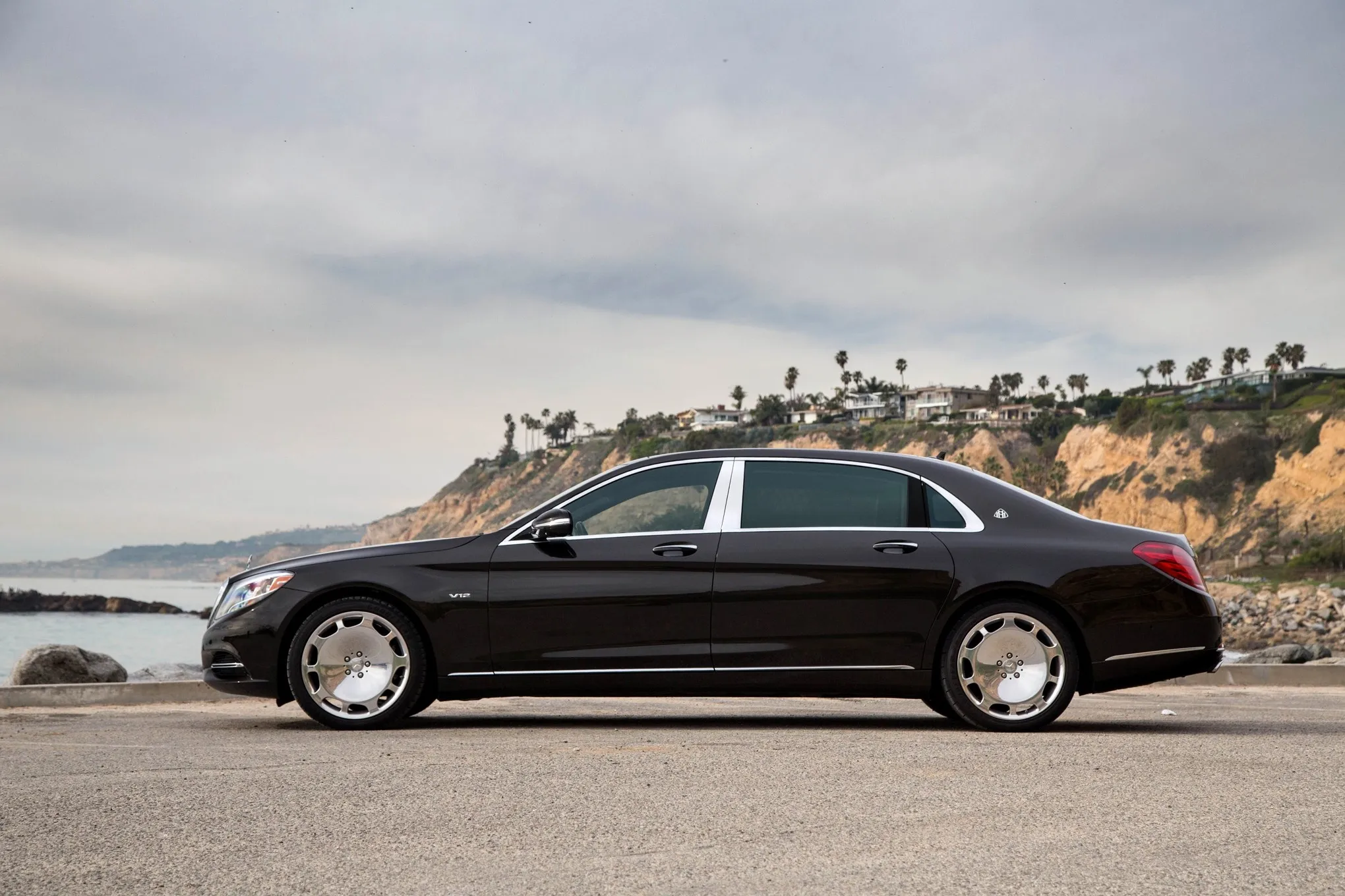 Mercedes Maybach Driving on Scenic Coastal Roadside
