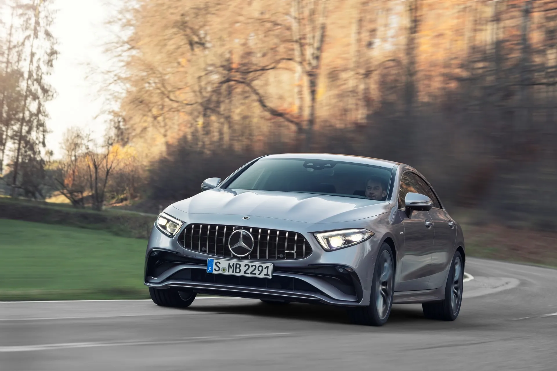 Mercedes Sedan Driving Through Forest Road HD image