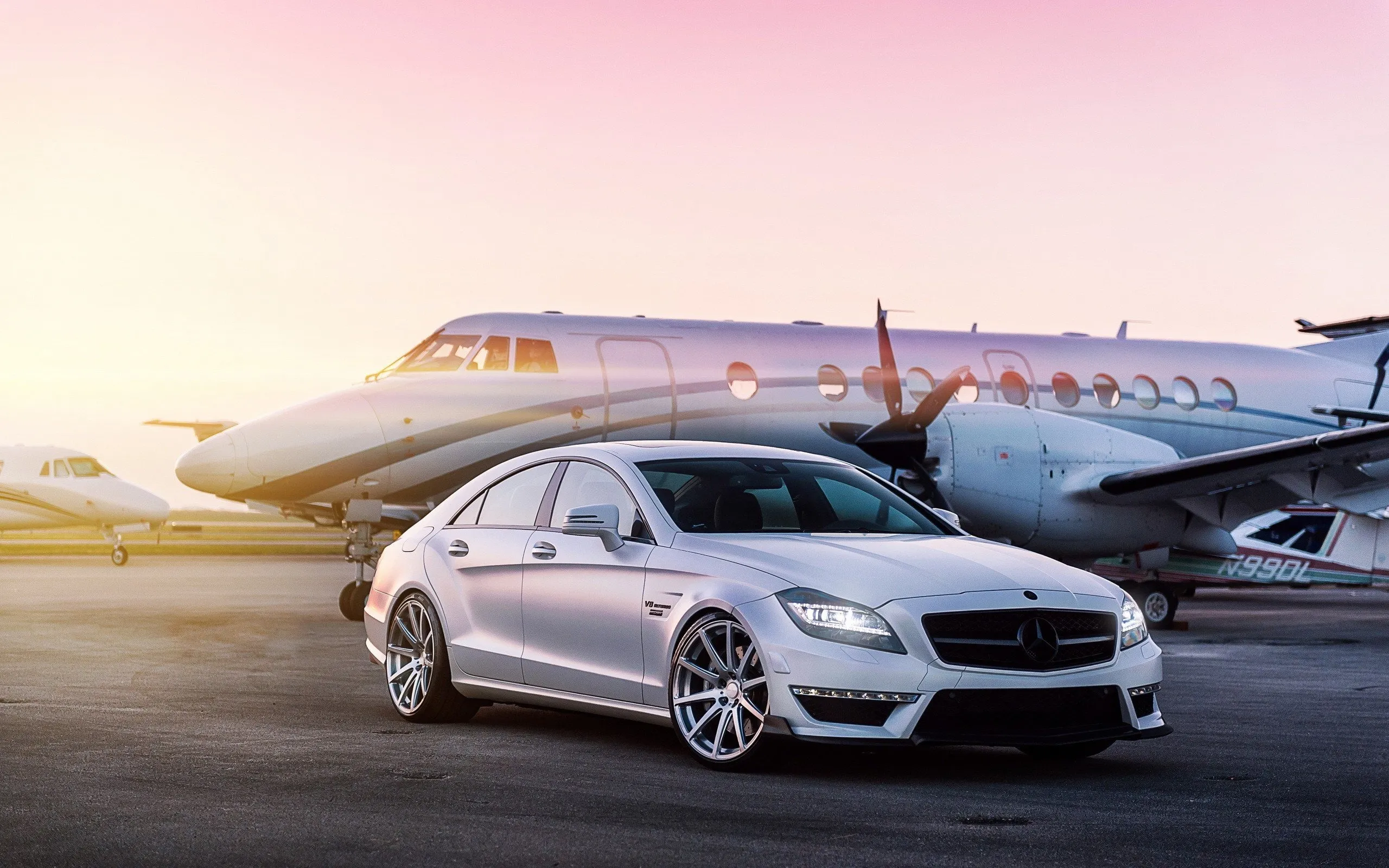 Mercedes Sedan Parked Beside Private Jet free Wallpaper