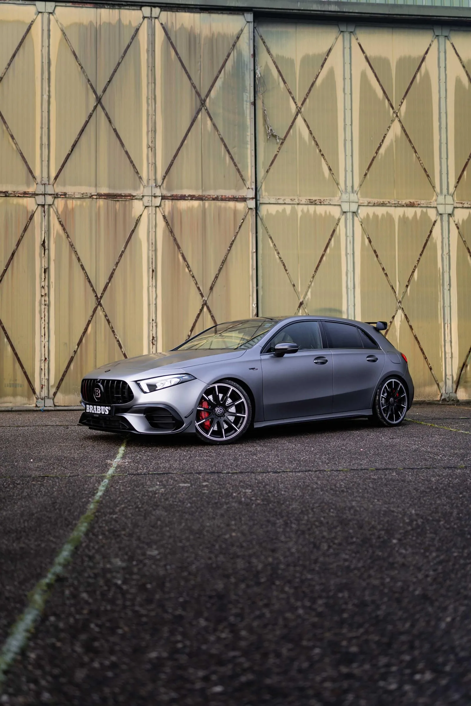 Mercedes Sporty Hatchback Parked By Industrial Door 4K image