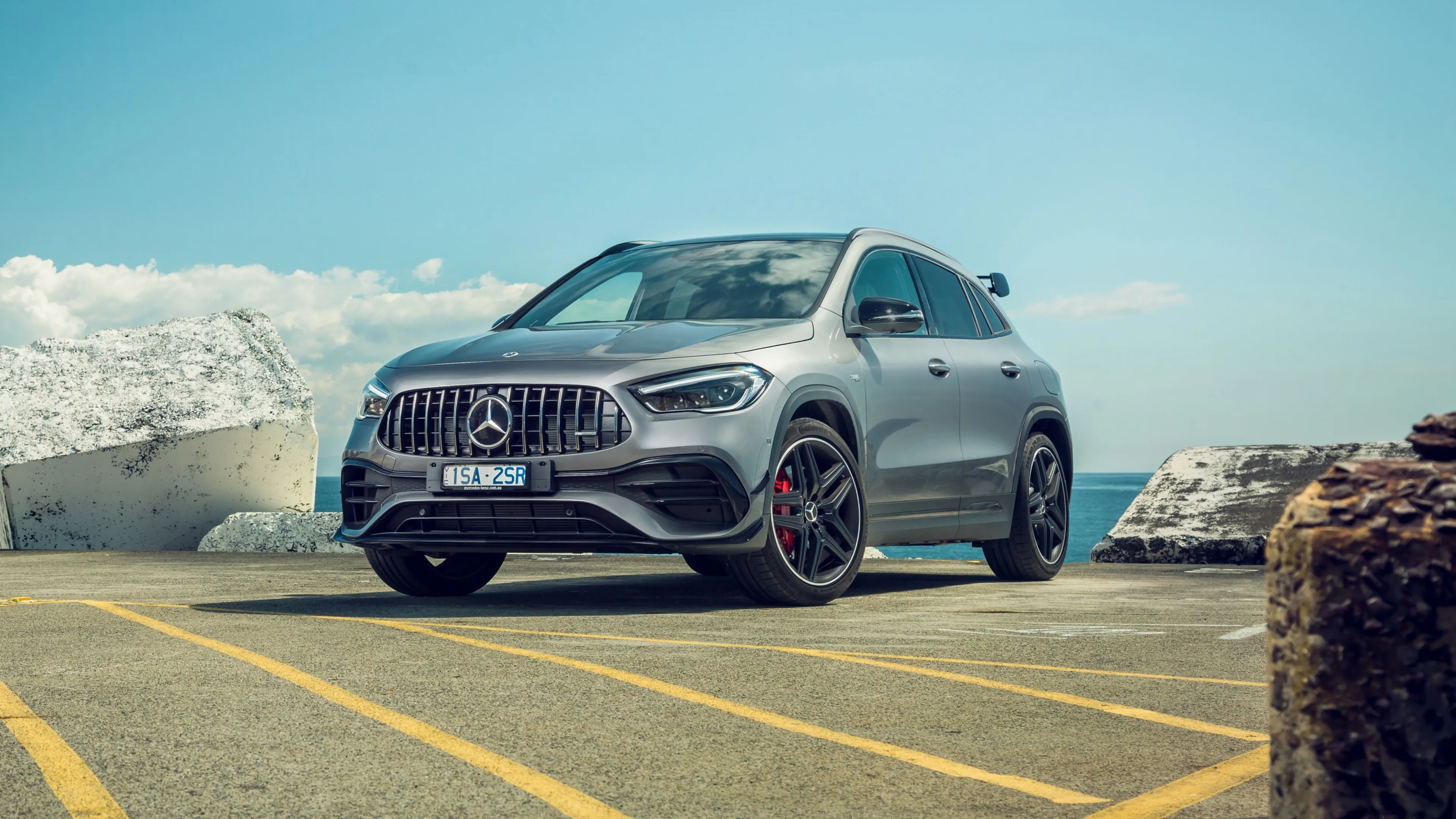 Mercedes SUV Displayed Near Coastal Ice and Rock Views