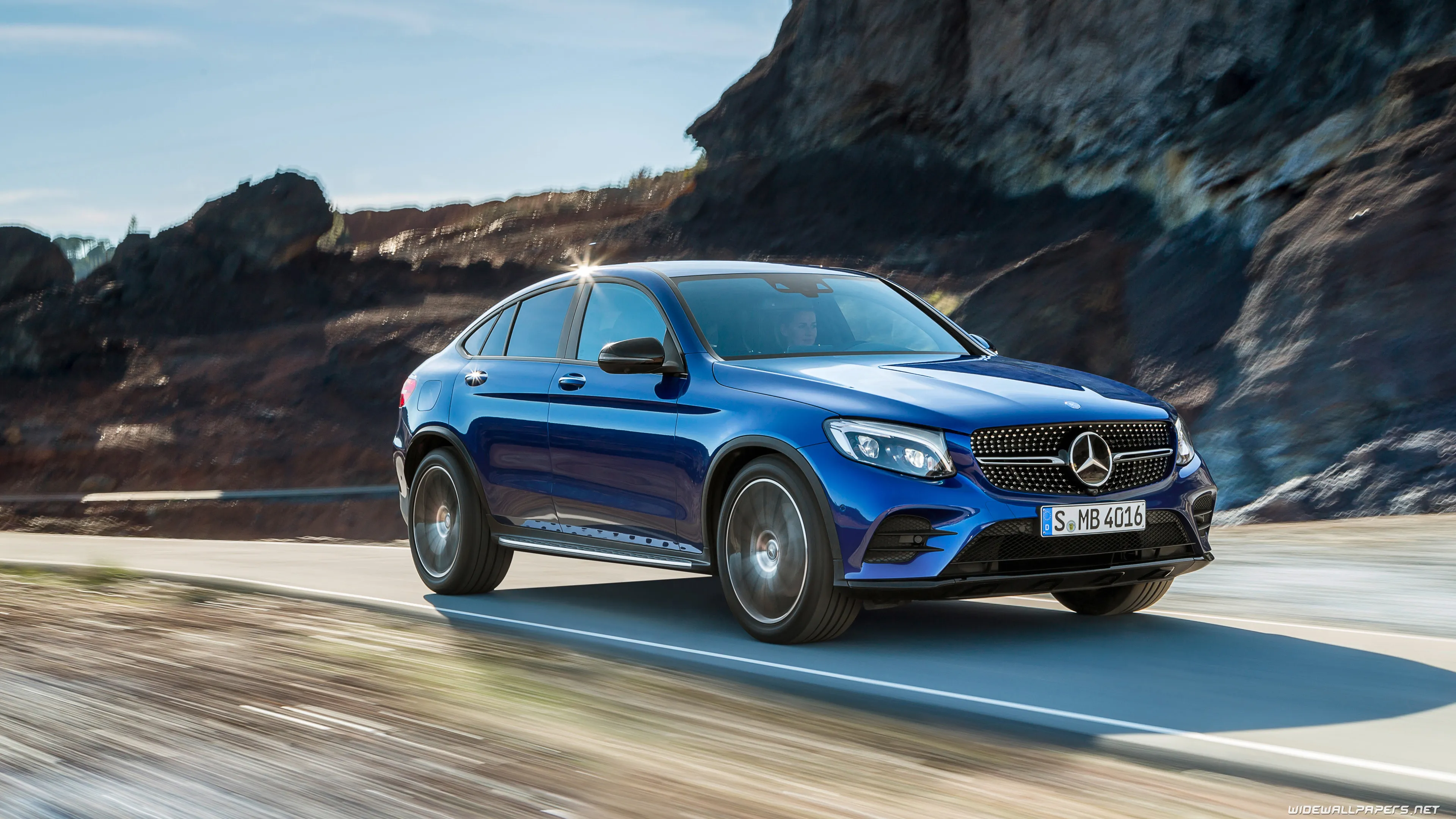 Mercedes SUV Driving Along Scenic Coastal Highway View