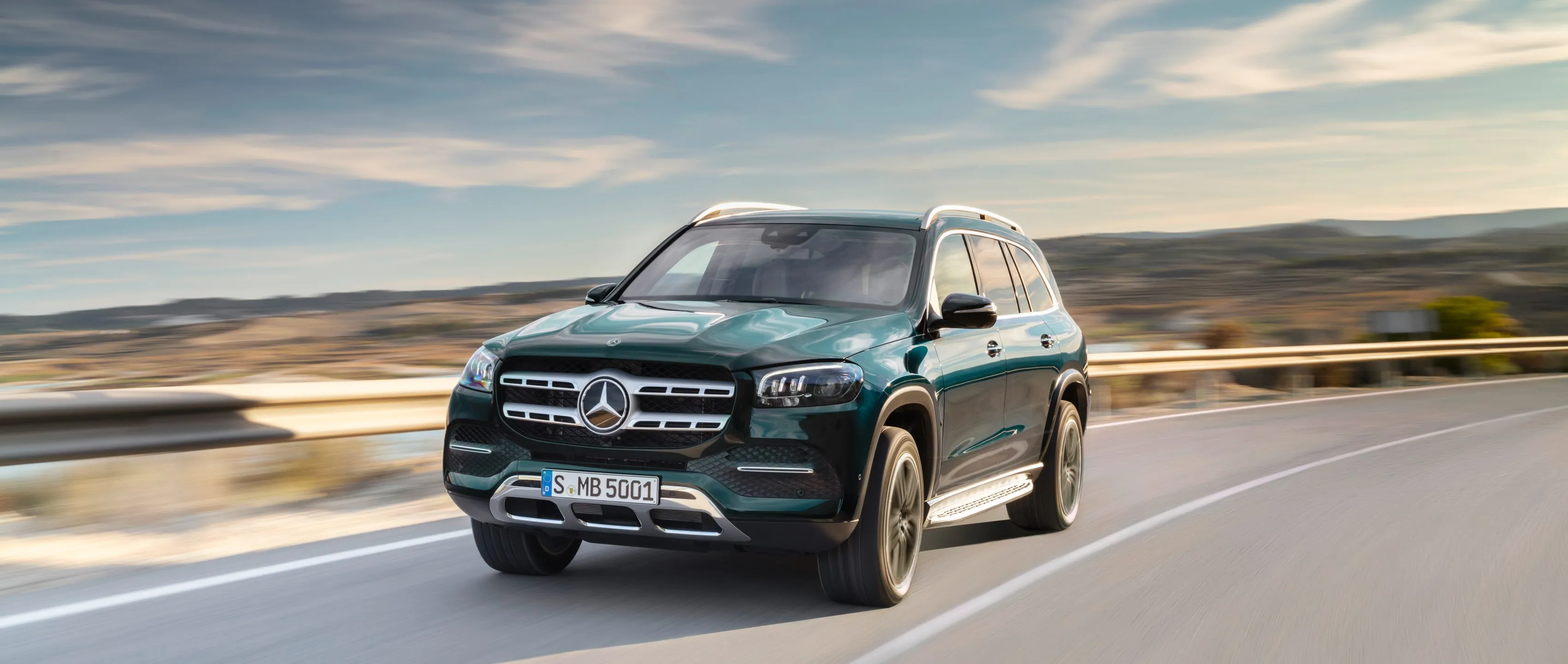 Mercedes SUV Driving Fast on Blurred Road at Golden Hour