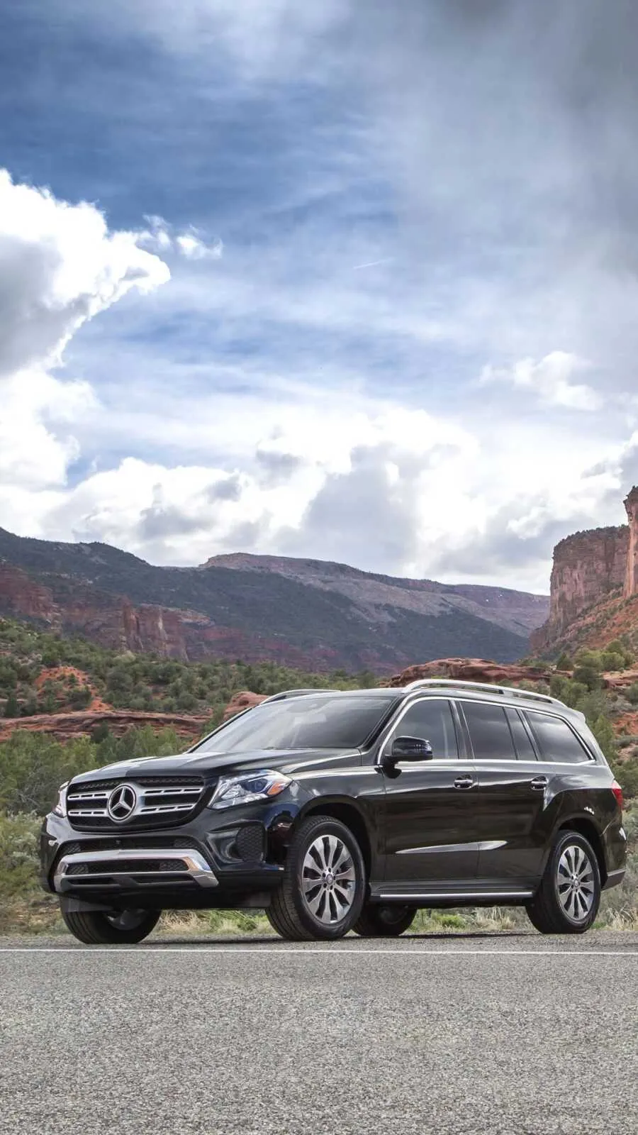 Mercedes SUV Driving Through Rocky Terrain HD image