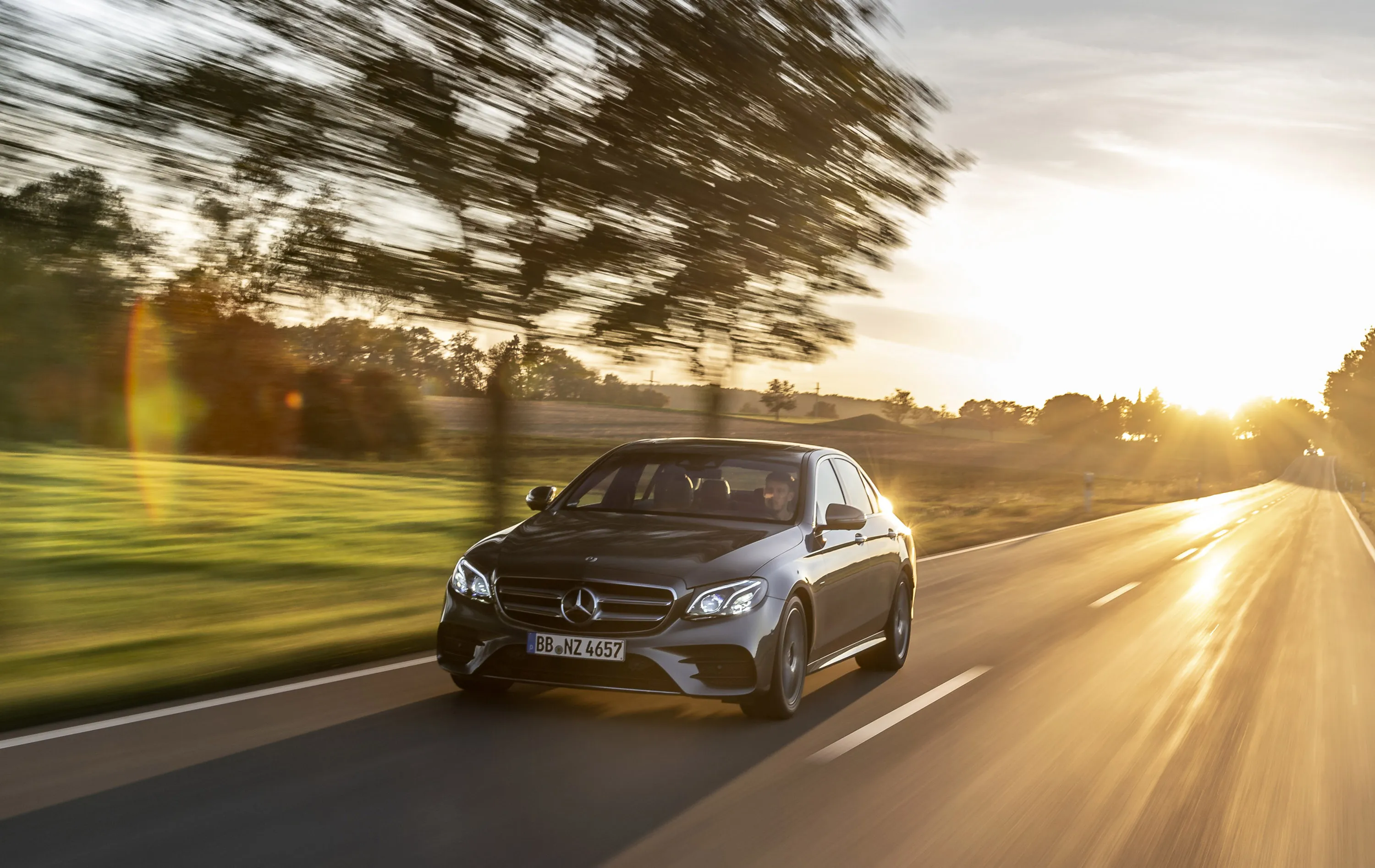 Mercedes SUV Driving Through Sunset Highway free HD image