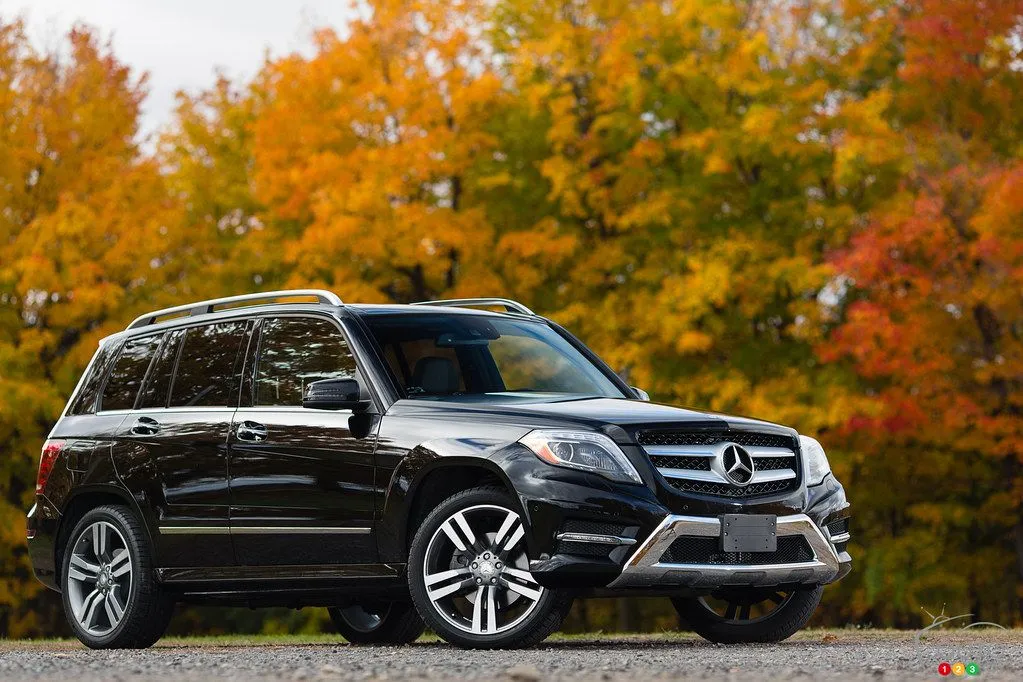 Mercedes SUV in Autumn Setting with Orange Trees Wallpaper