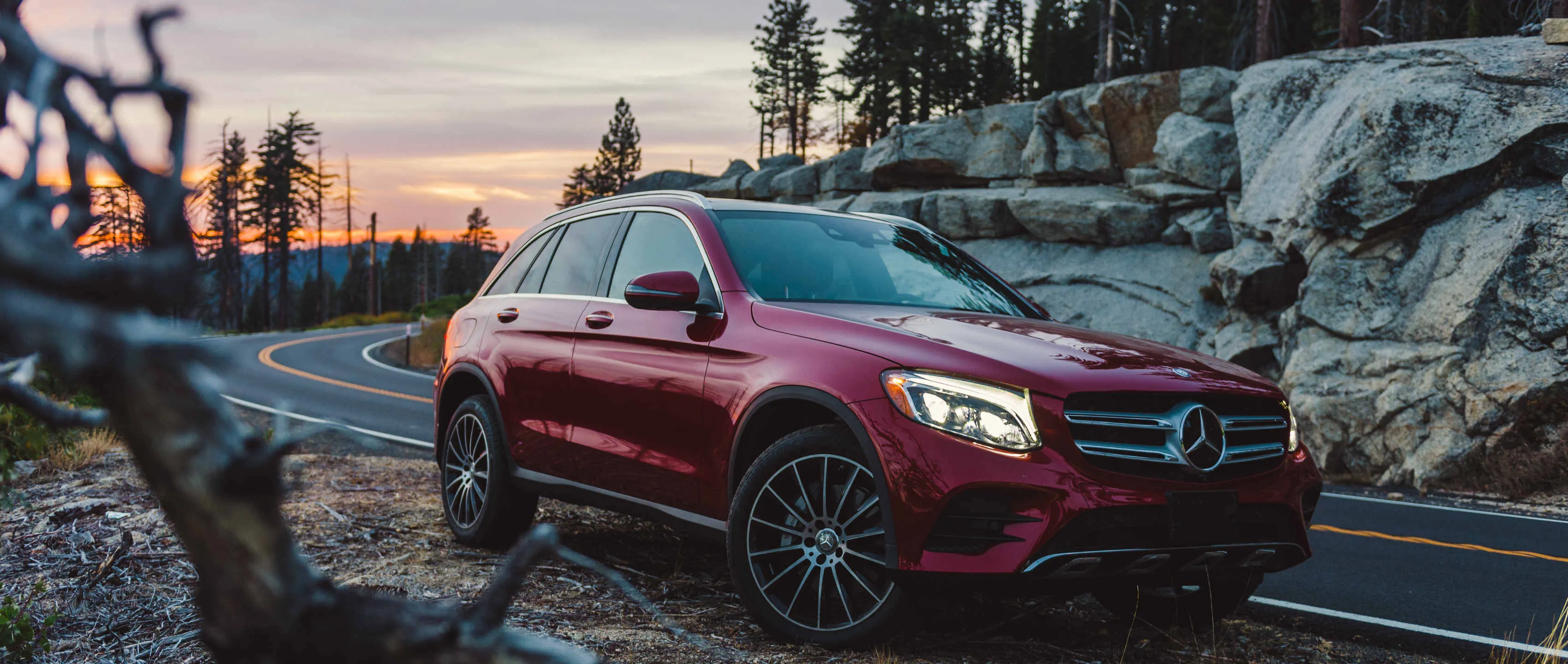 Mercedes SUV Parked in Forest Mountains During Sunset