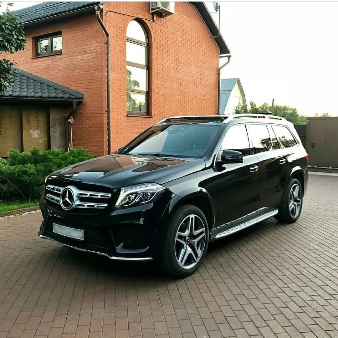 Mercedes SUV Parked in Front of Brick House Wallpaper