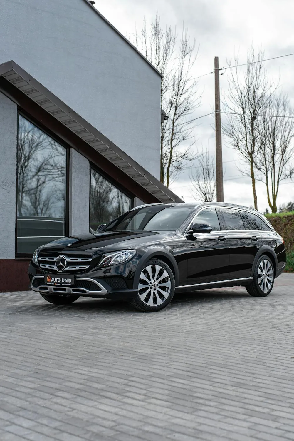 Mercedes SUV Parked in Front of Minimalist Modern Home
