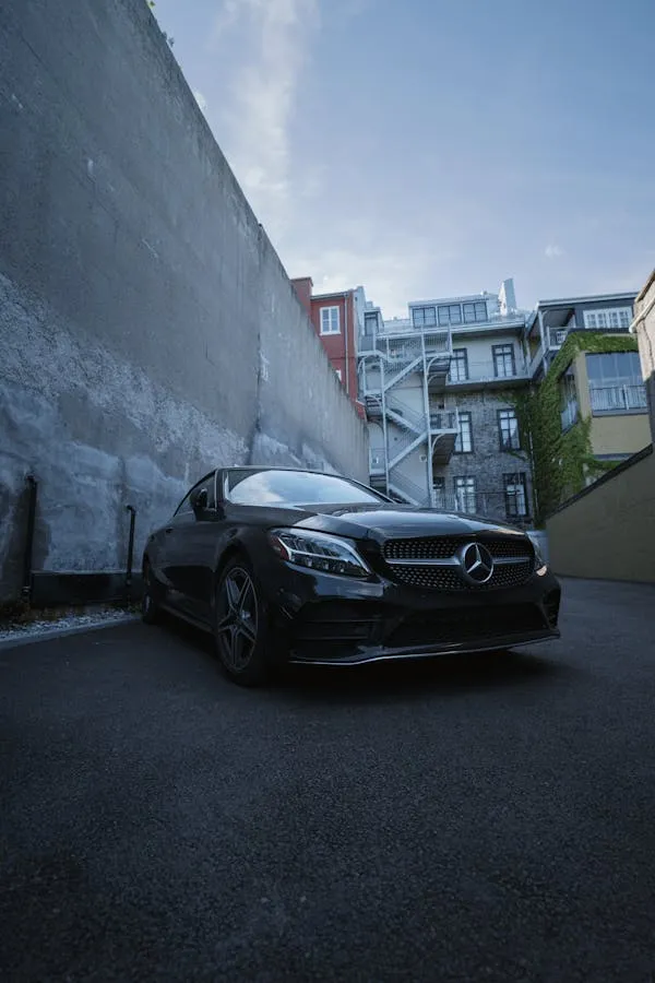 Modern Black Mercedes Benz Sedan in Narrow Urban Alley