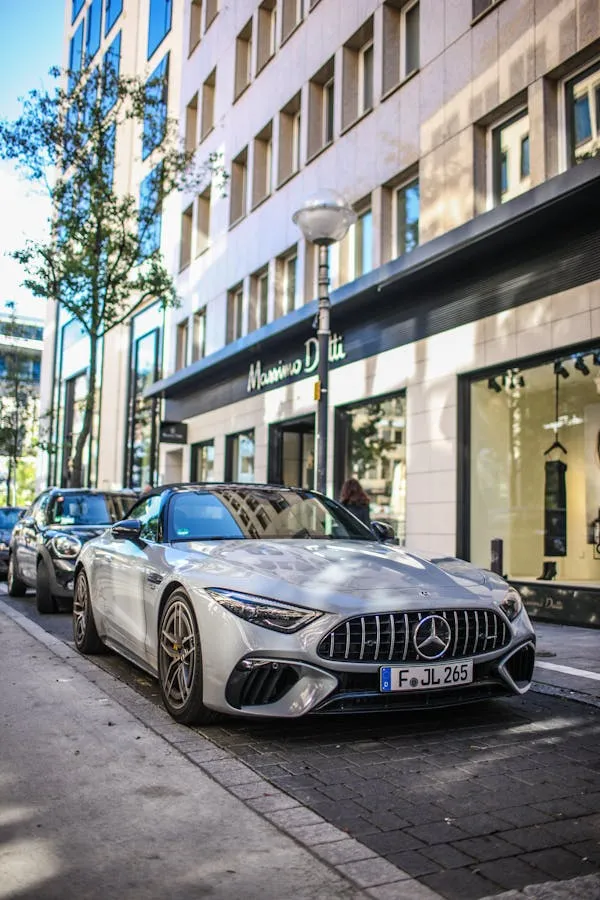 Modern Mercedes AMG Parked Outside Luxury Boutique Wallpaper