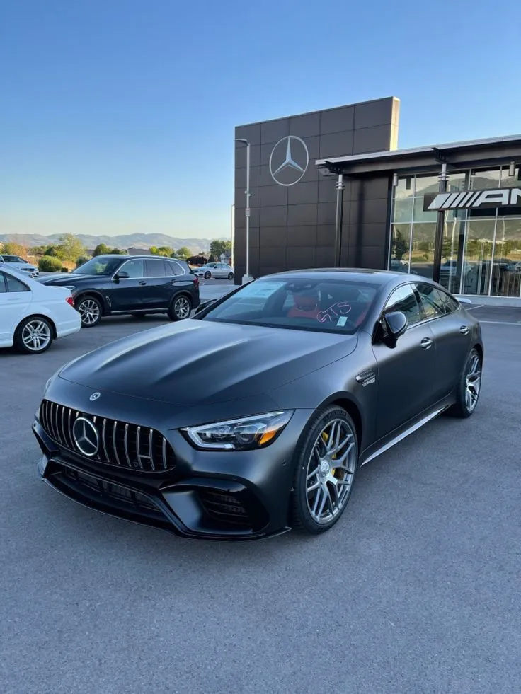 Modern Mercedes Benz AMG Sedan Outside Dealership image