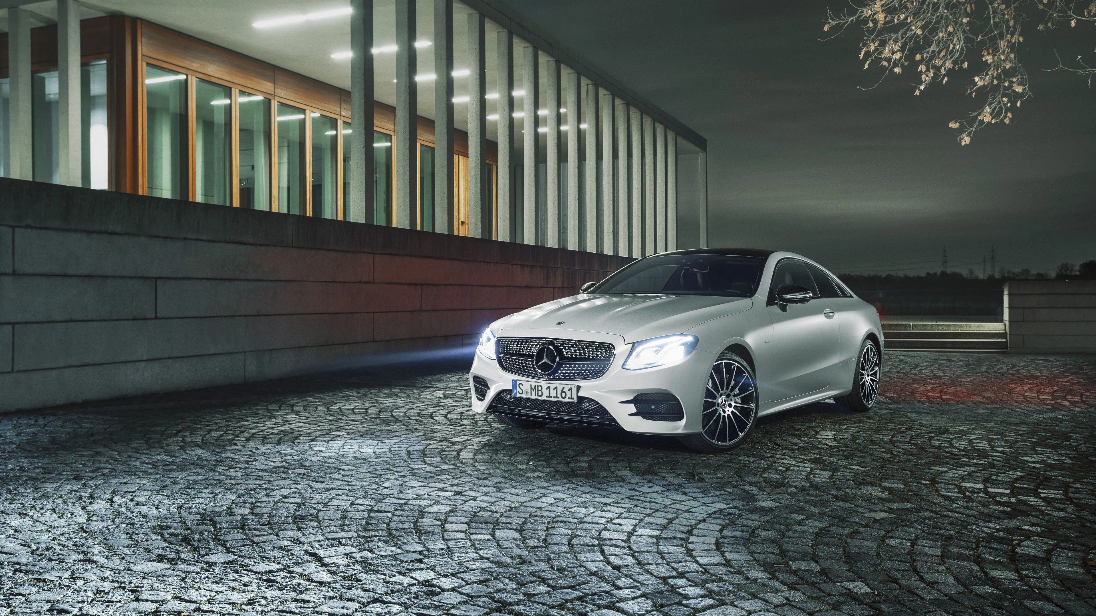 Modern Mercedes Benz Coupe Parked by Urban Building image