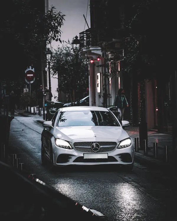 Modern Mercedes Benz in Urban Street at Dusk HD image