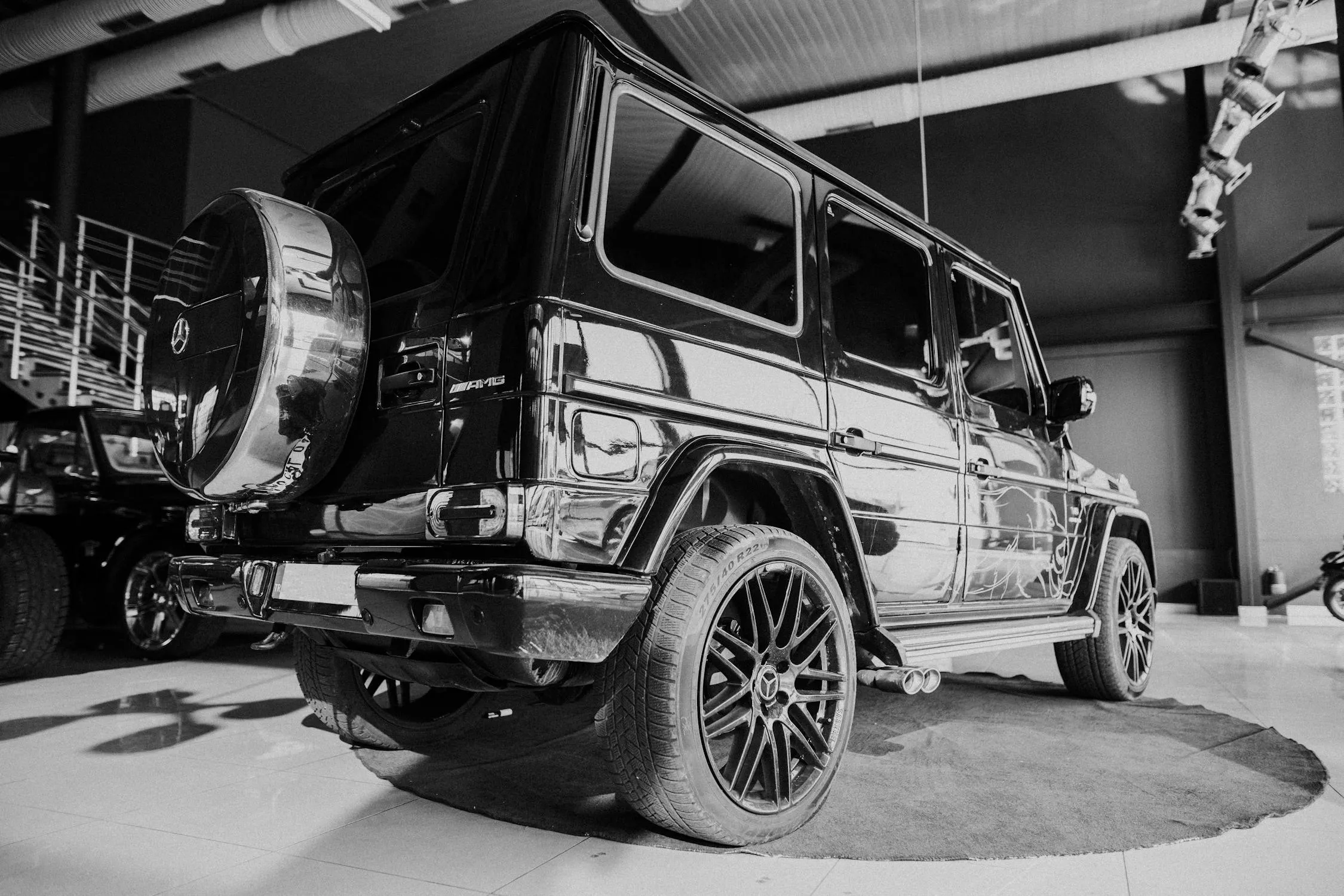 Monochrome of Black Mercedes Benz G Wagon inside a garage