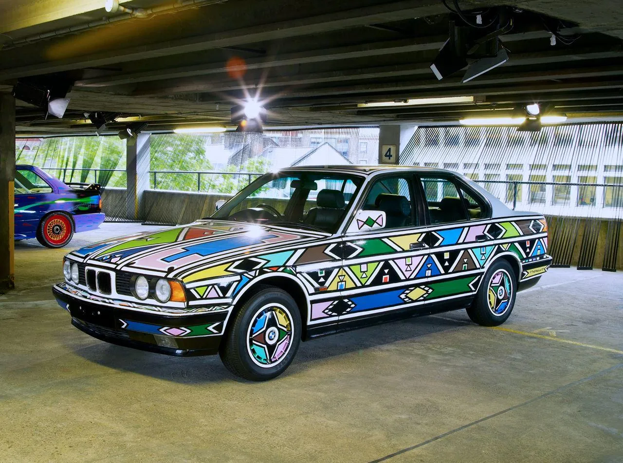 Multicolor Art Car Bmw Displayed in Parking Area Wallpaper