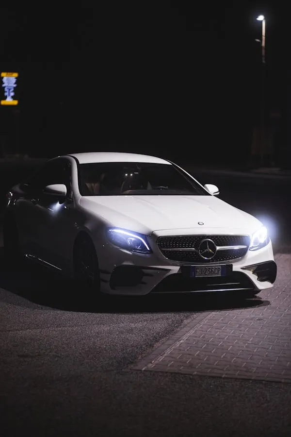 Night Shot of Black Mercedes Benz Car with Headlights On
