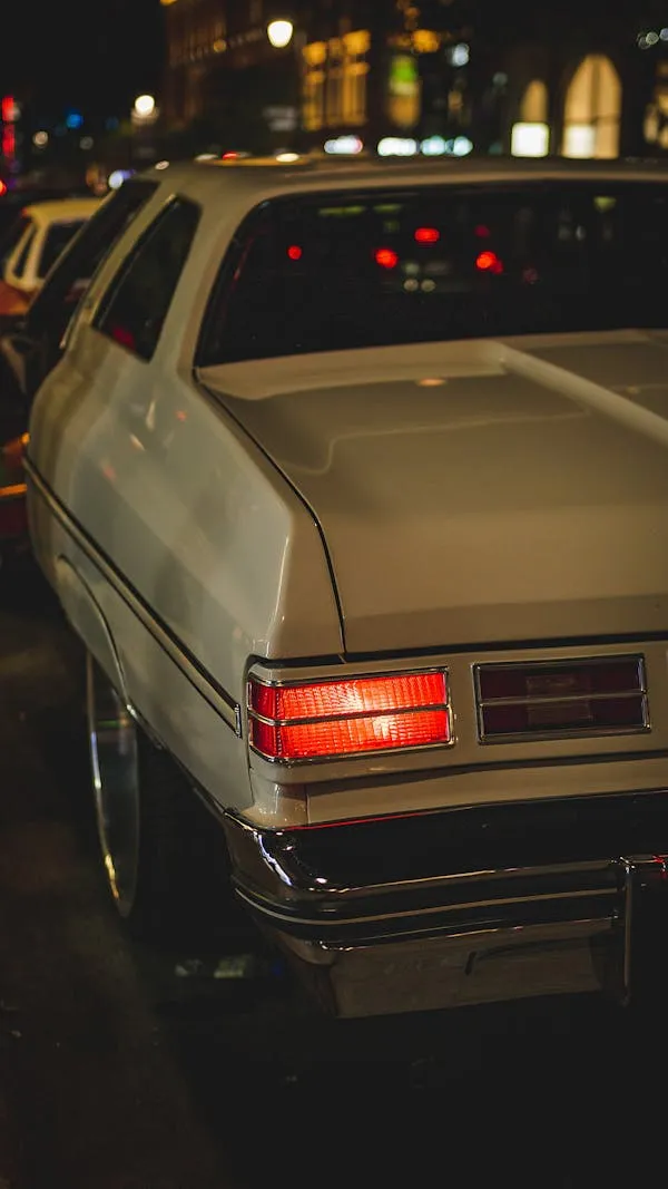 Night Shot of Classic Mercedes Benz Driving on Street