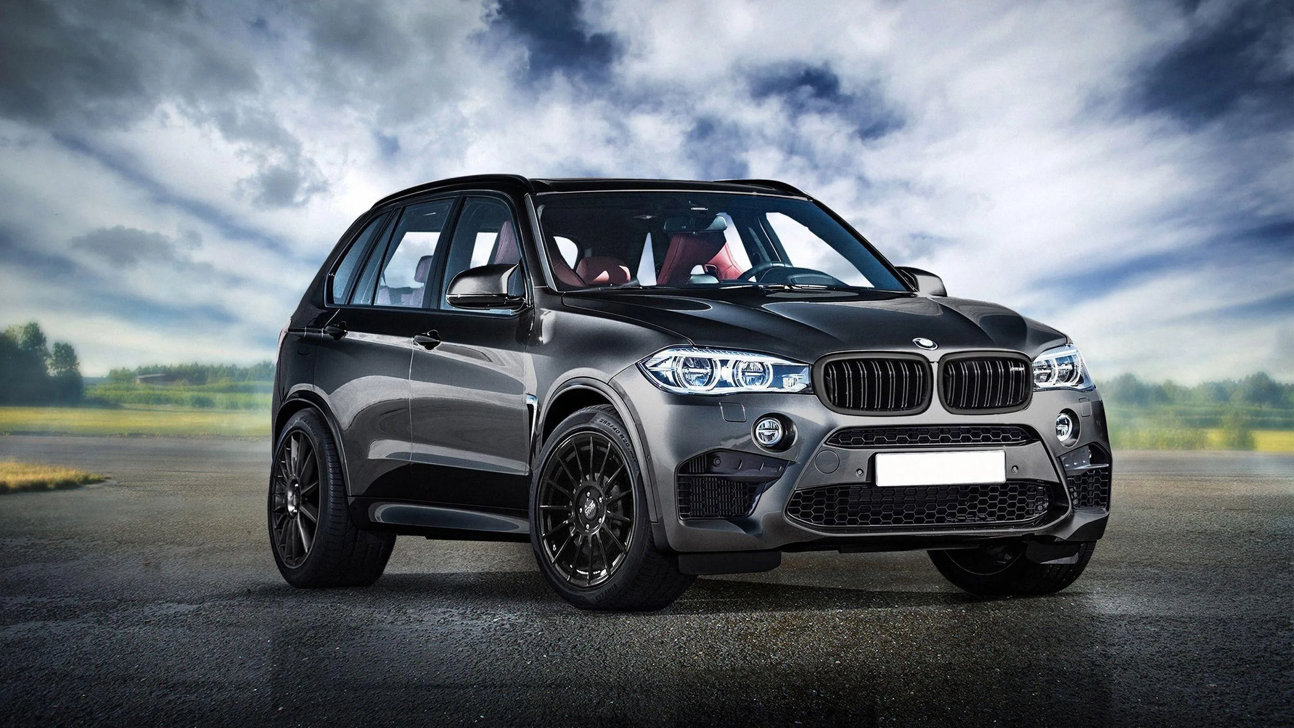 Offroad Bmw Parked on Rough Terrain with Cloudy Skies