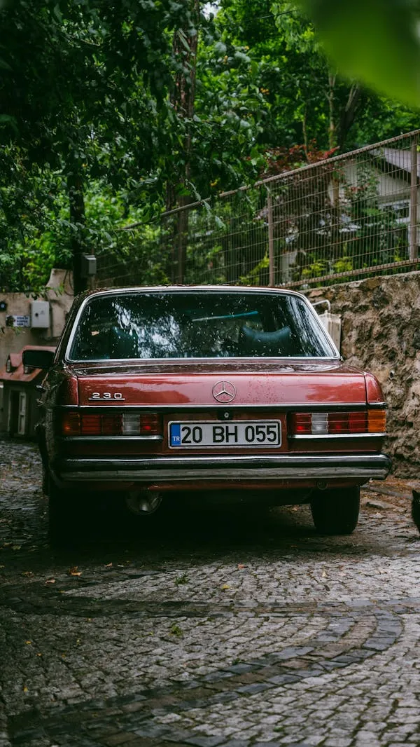 Old Mercedes Benz Parked on Brick Road Near Trees Wallpaper