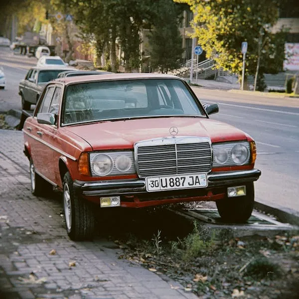 Old Red Mercedes Benz Car Parked on Urban Sidewalk HD