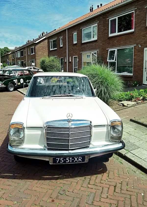 Old White Mercedes Benz Parked in Urban Street image
