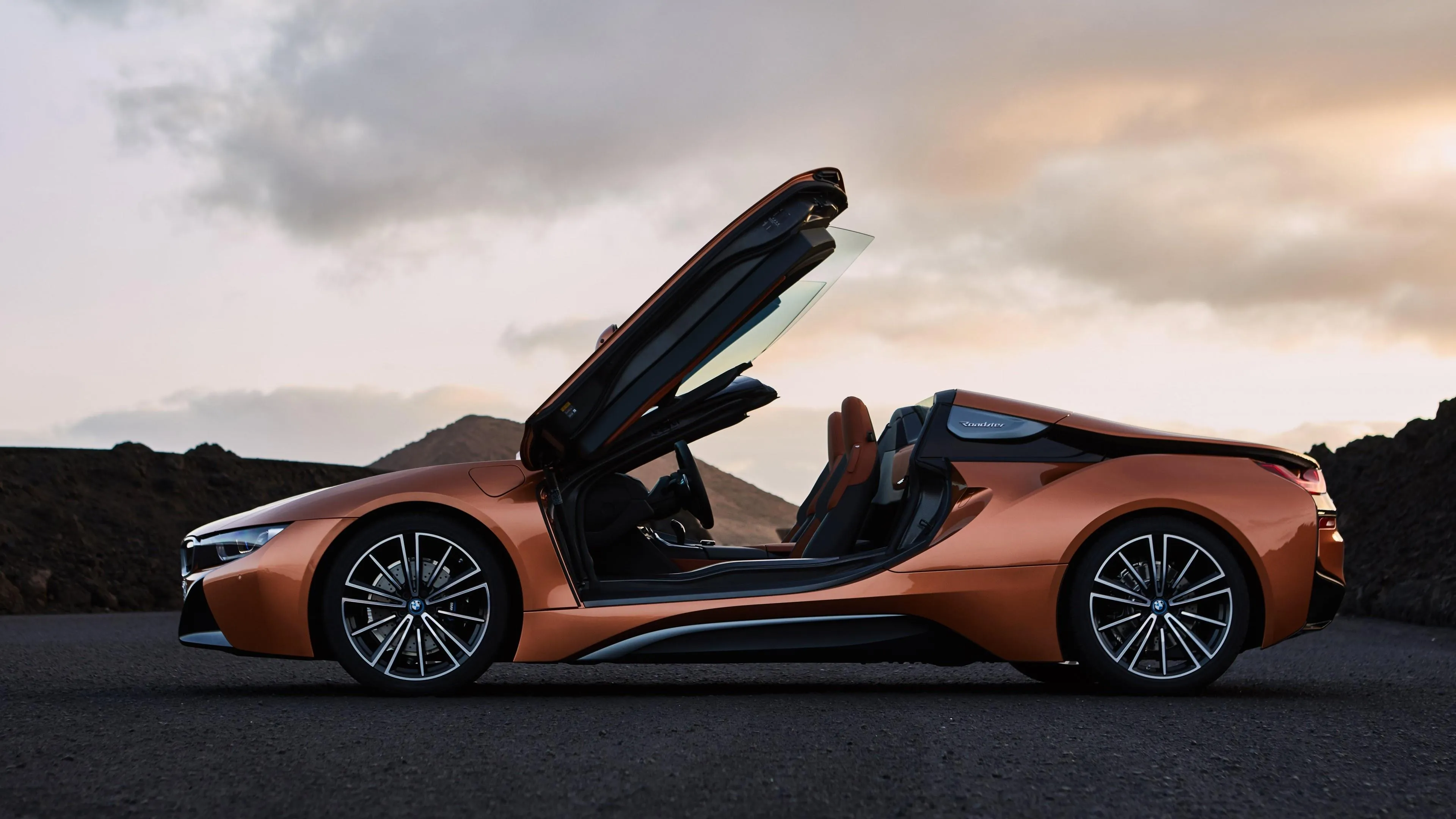 Orange Bmw Convertible Parked at Sunset Free Hd Image