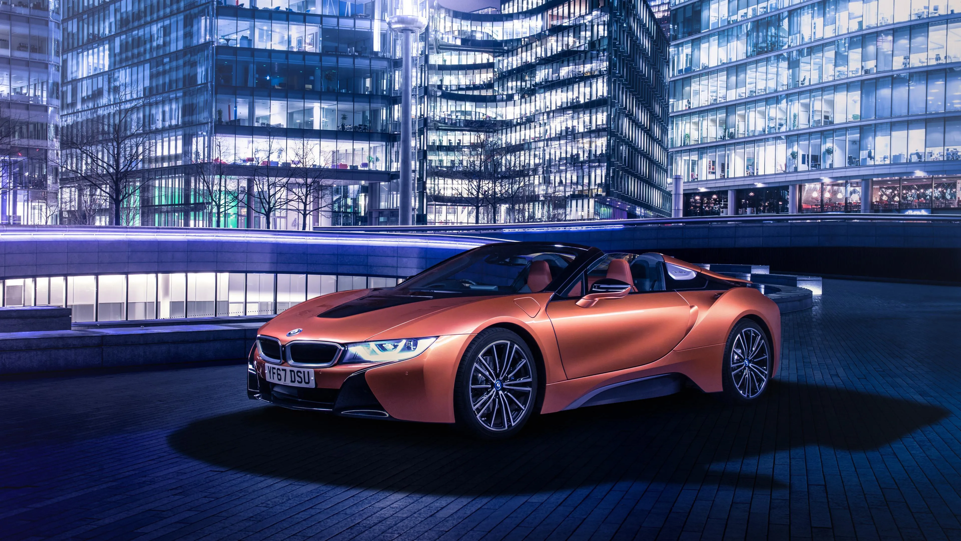 Orange Bmw Sports Car in Futuristic Cityscape Night View