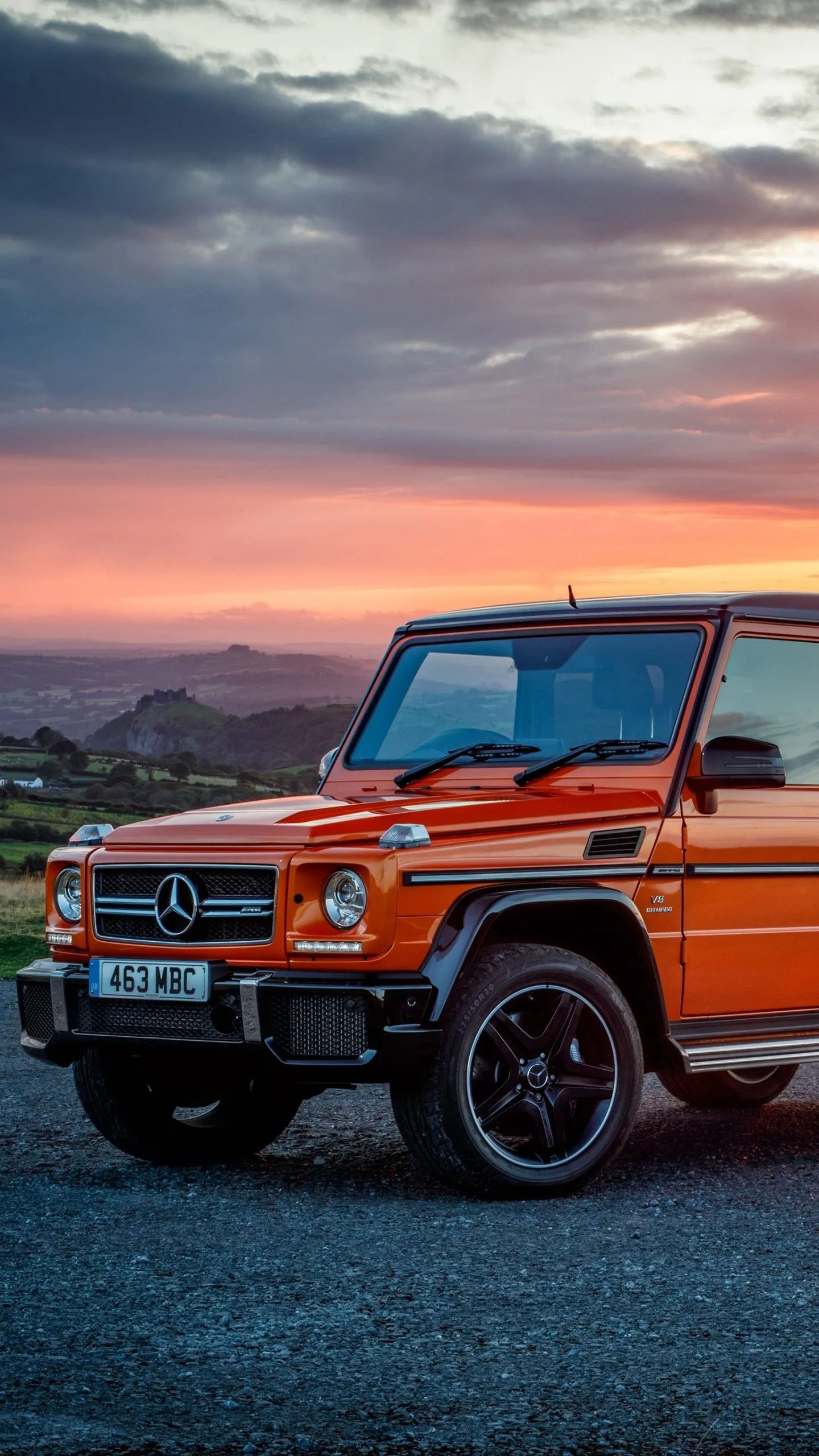 Orange Mercedes Benz G Wagon in Evening Setting Wallpaper