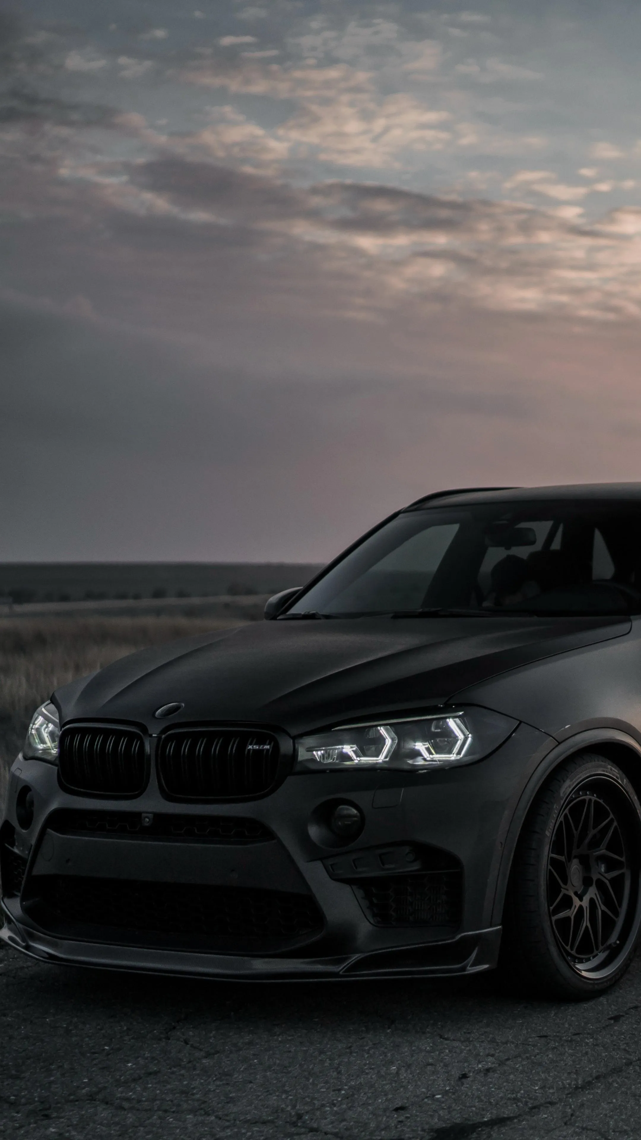 Powerful Black Bmw Front View Captured at Dusk Hd Image