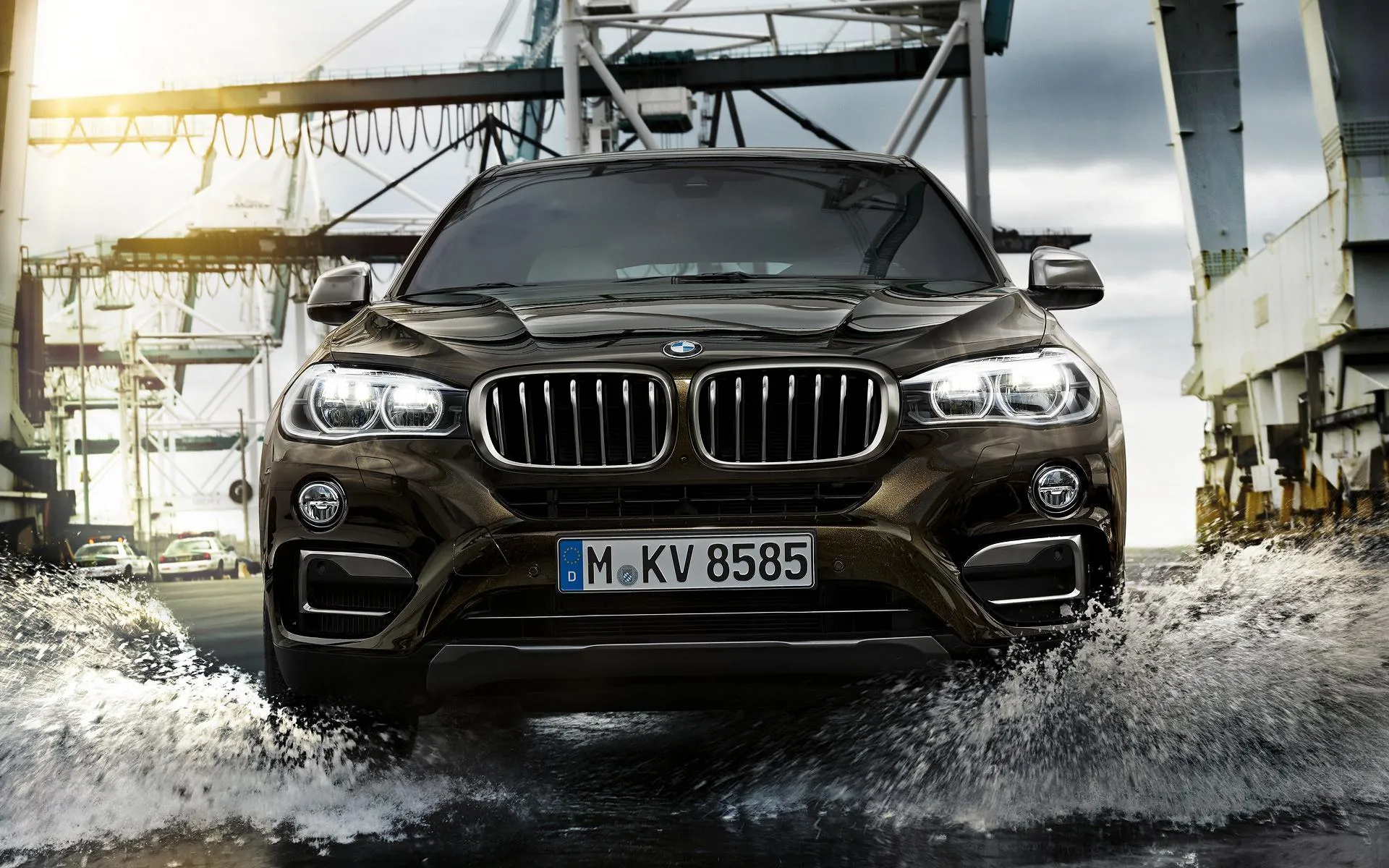 Powerful Bmw Suv Splashes Through Water in Motion Shot
