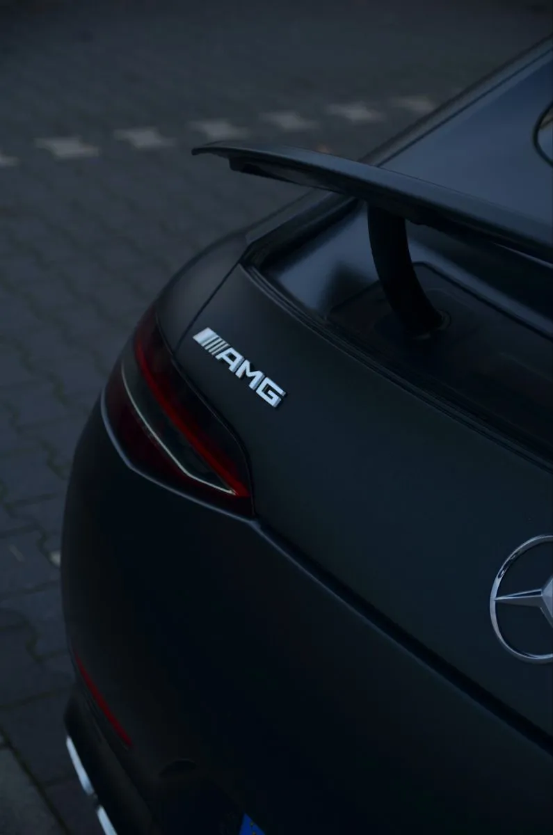 Rear Angle of Black Mercedes AMG with Night Lighting