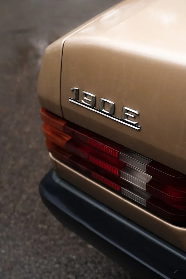 Rear Badge of Vintage Mercedes Benz 190E in Beige Color