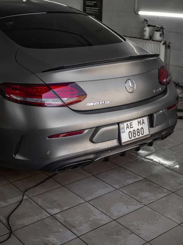 Rear Closeup of Silver Mercedes Benz in Car Wash Wallpaper