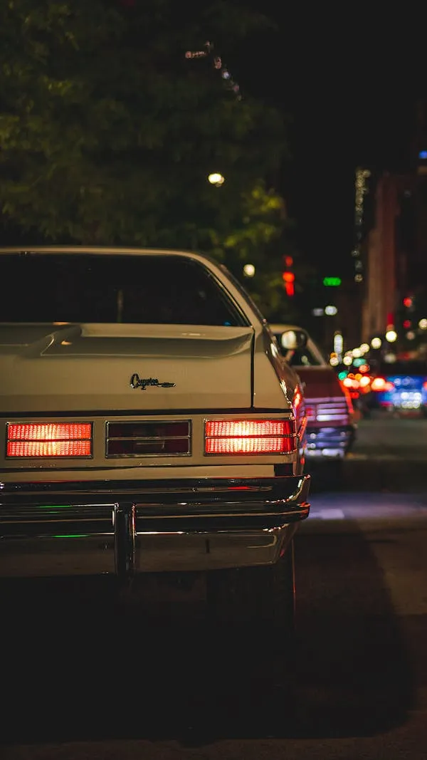 Rear Lights of Classic Mercedes Benz at Night Street